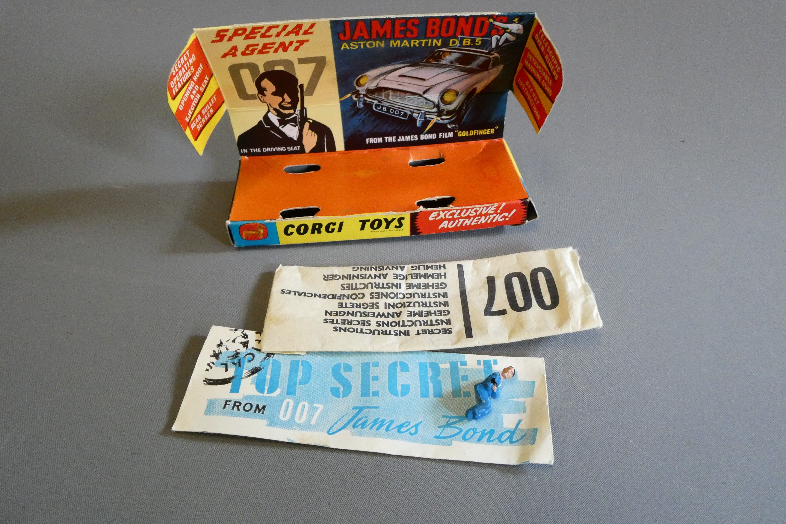 Corgi 261 James Bond Aston Martin DB5, first edition in gold with instructions and spare passenger. Image