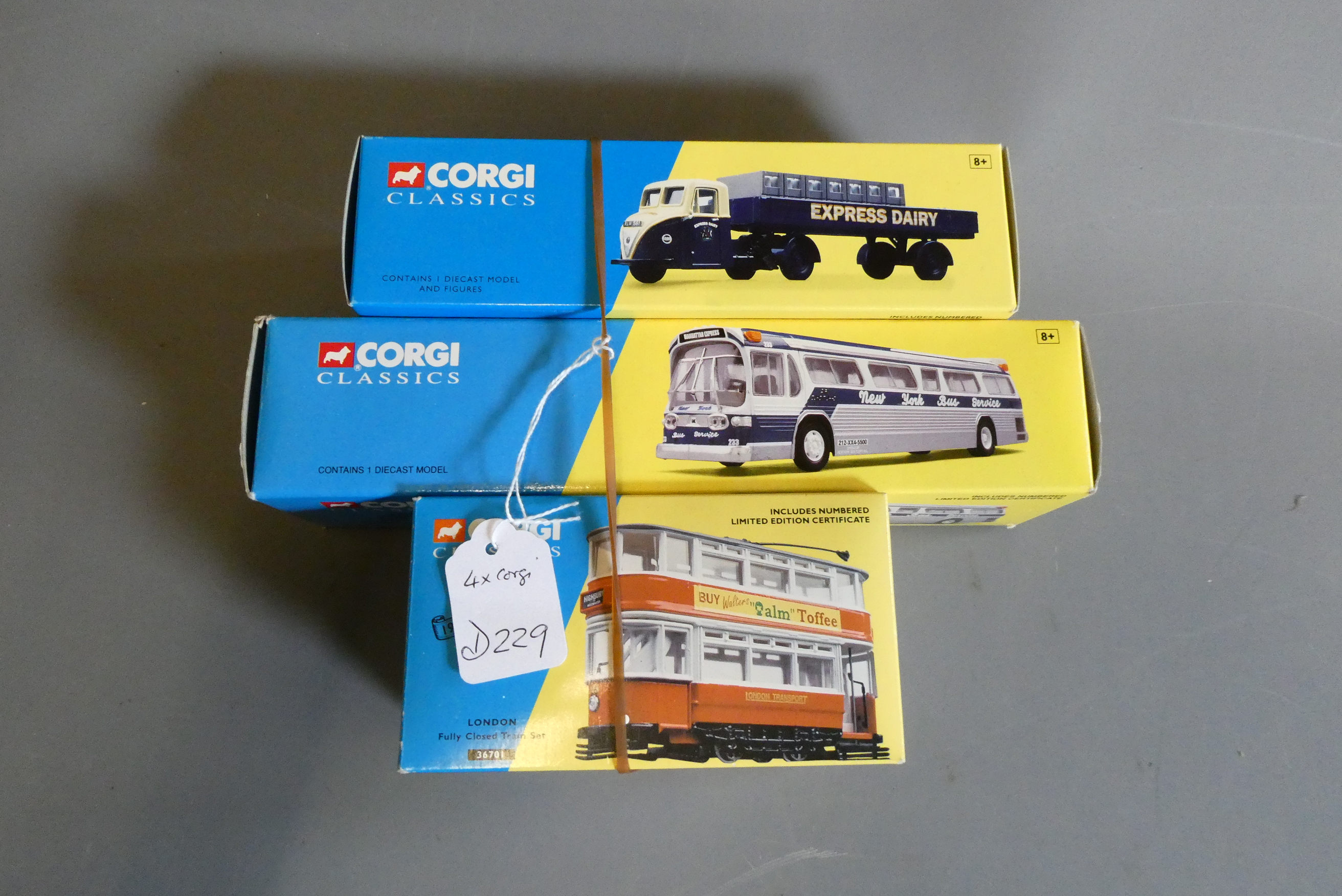 Corgi Classics comprising two London trams, Scammell Scarab Express Dairy and New York bus. All Image