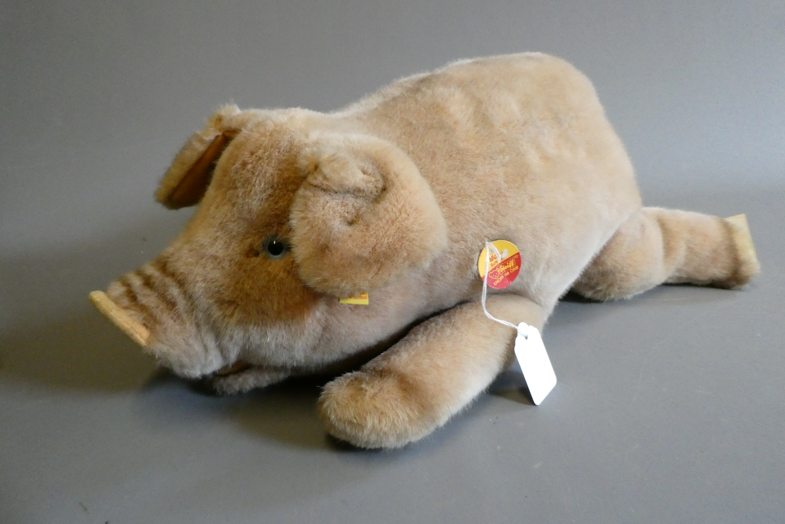 A vintage Steiff Molly Schwein/pig, with ear button, fabric label and cardboard labels, 22" long Image