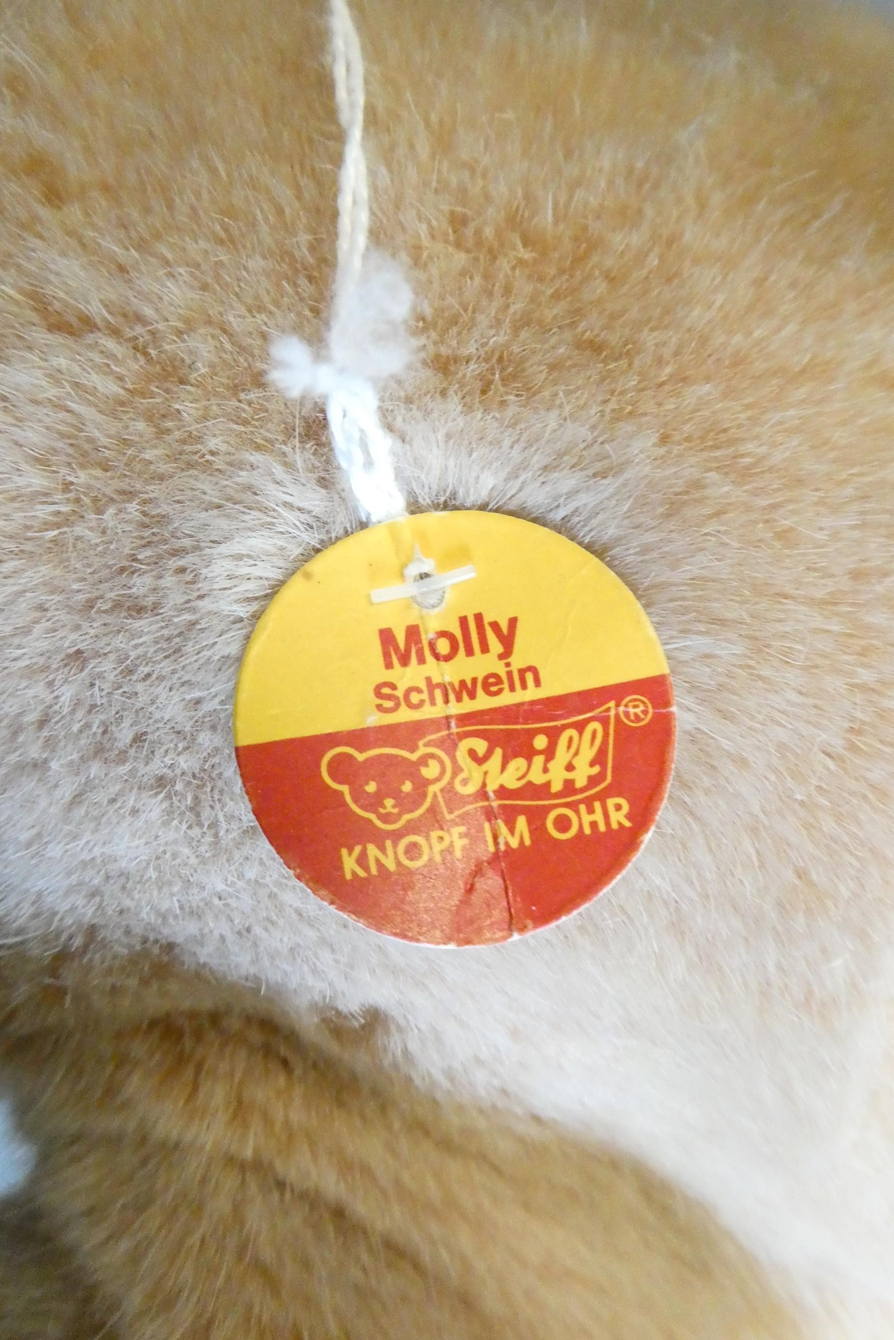 A vintage Steiff Molly Schwein/pig, with ear button, fabric label and cardboard labels, 22" long Image