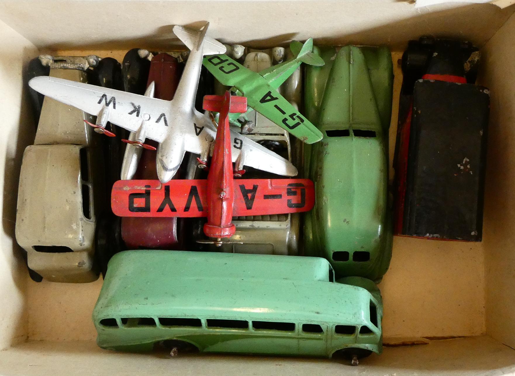 Early Dinky vehicles including four saloon cars, Post Office van, bus and three aircraft. Fair to Image