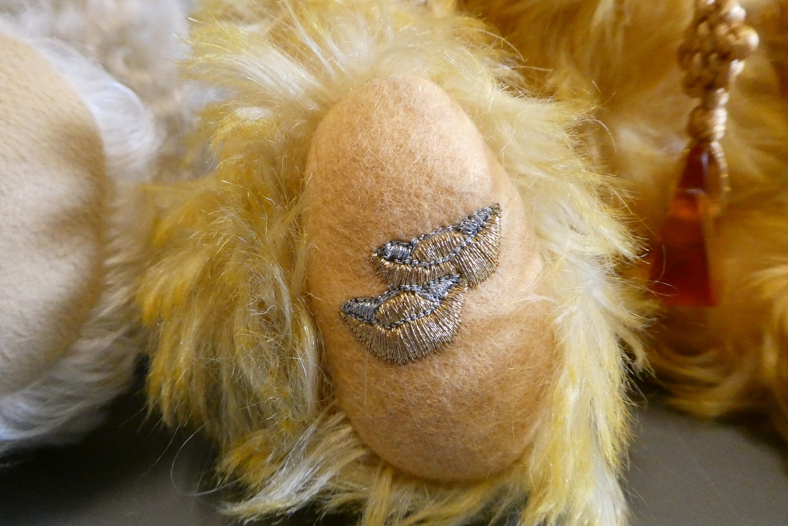 Two Steiff collectors bears, comprising a 32cm 2001 bear with orange glass medallion, and a 31cm Image