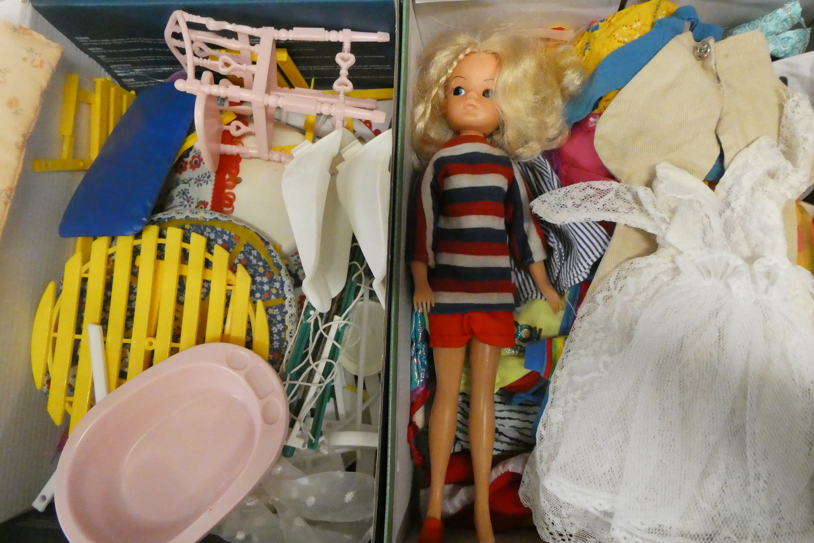 A collection of Sindy items, including one 033055X doll, a mixture of Sindy clothing, Sindy house Image
