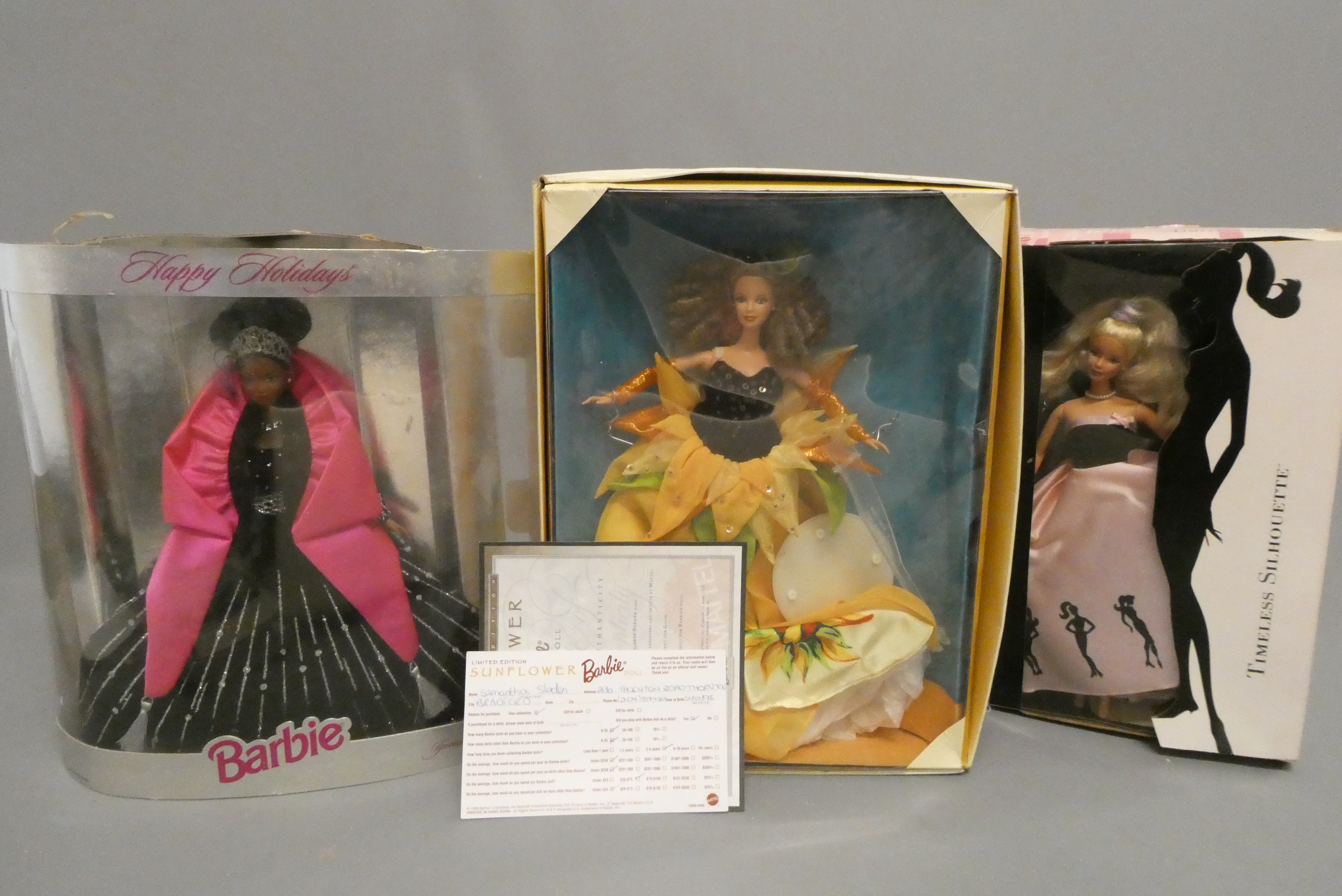 Three boxed Barbie dolls comprising a Happy Holidays doll, a Van Gogh limited edition and a Timeless Image