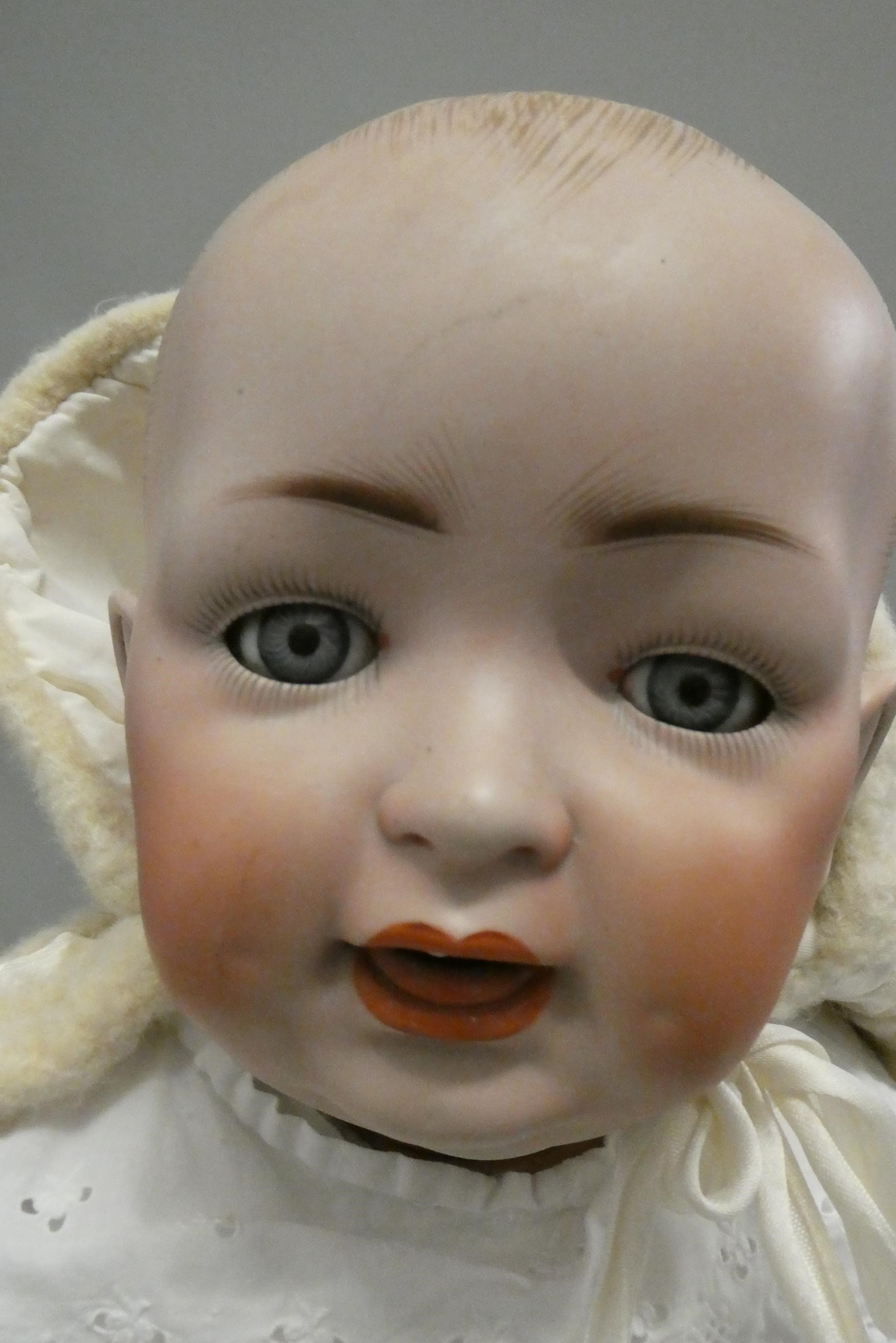 A bisque socket head character baby doll Image