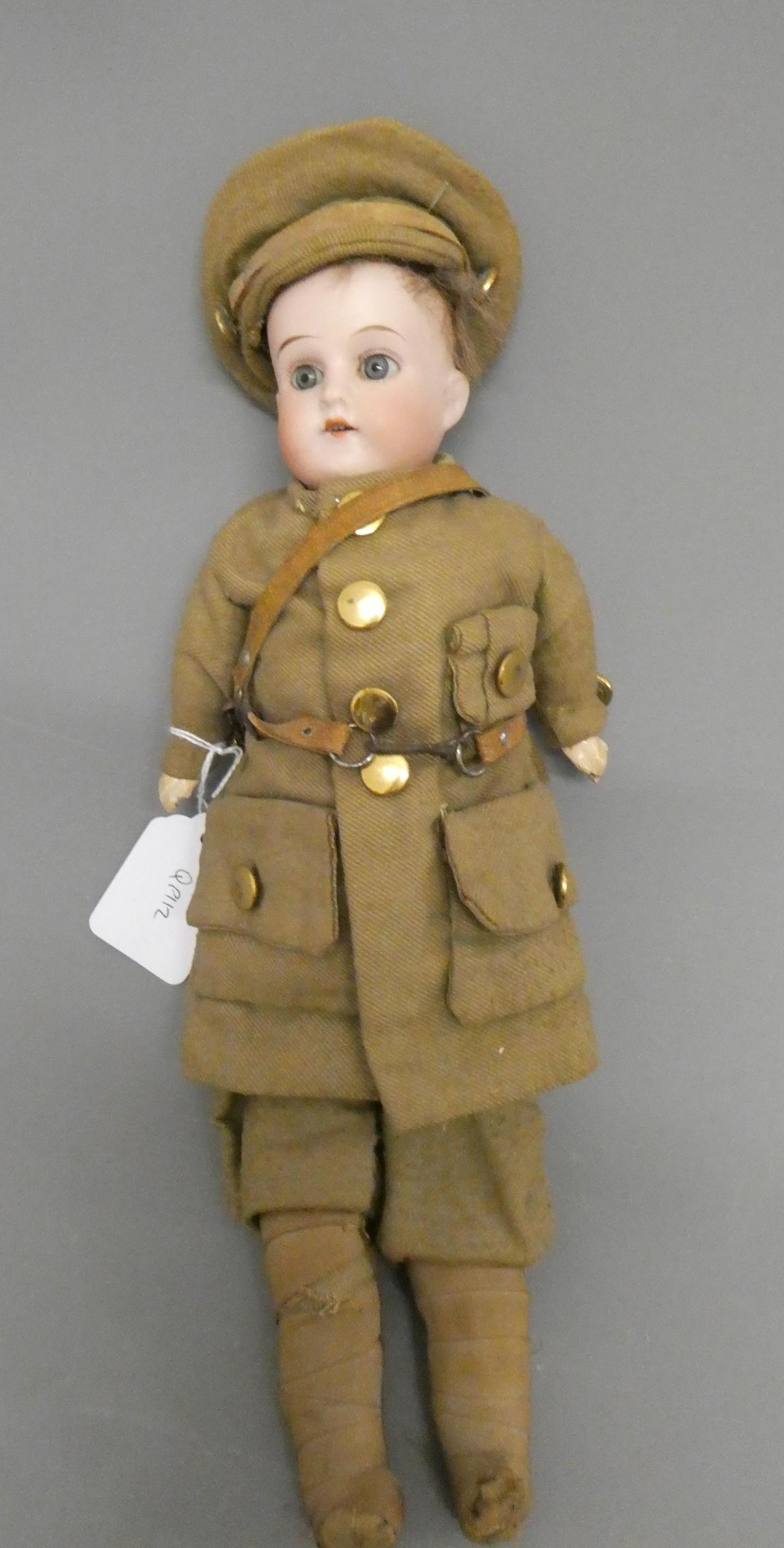 An Armand Marseille Mabel bisque shoulder head soldier doll Image