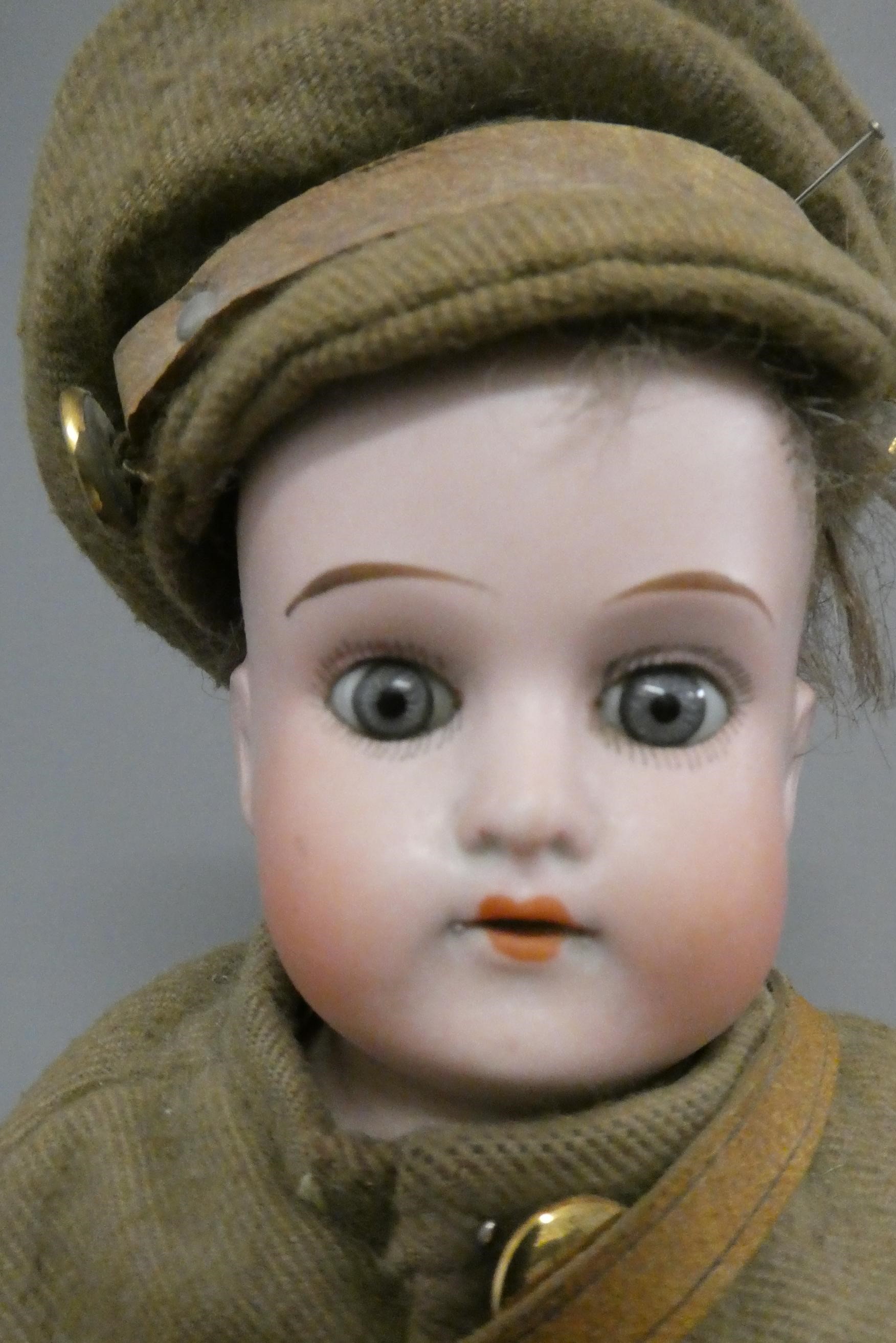 An Armand Marseille Mabel bisque shoulder head soldier doll Image