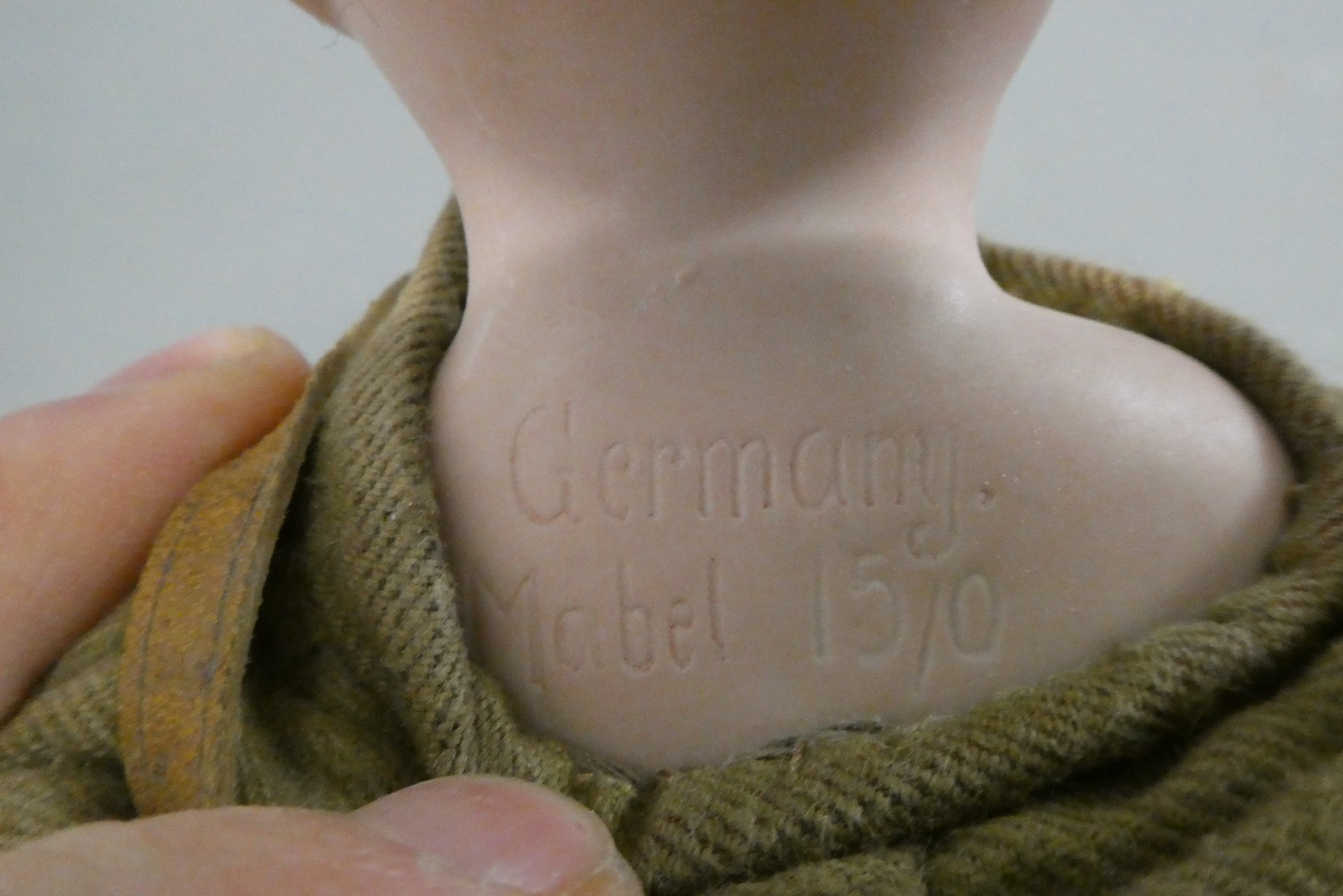 An Armand Marseille Mabel bisque shoulder head soldier doll Image