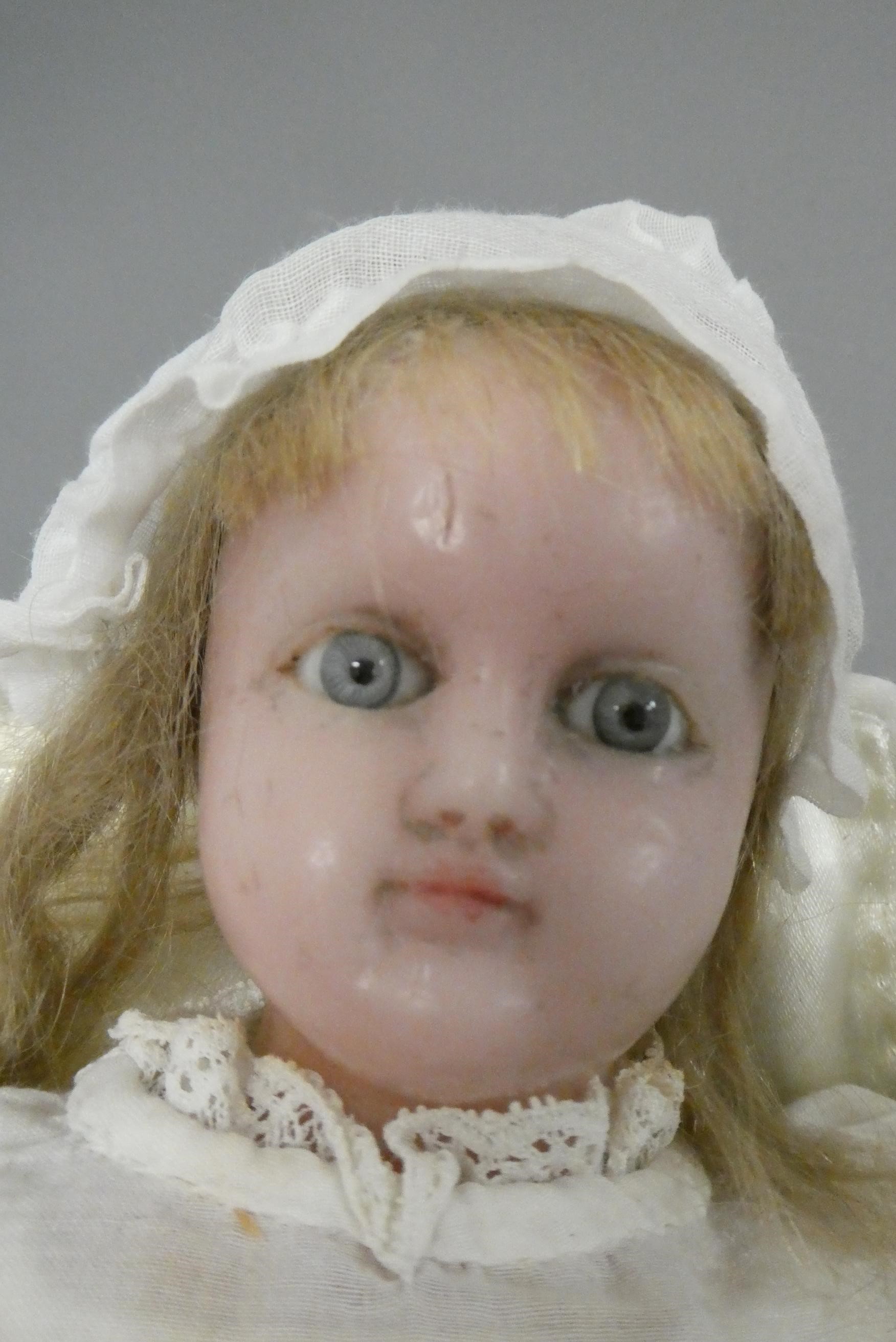 Two wax head dolls Image