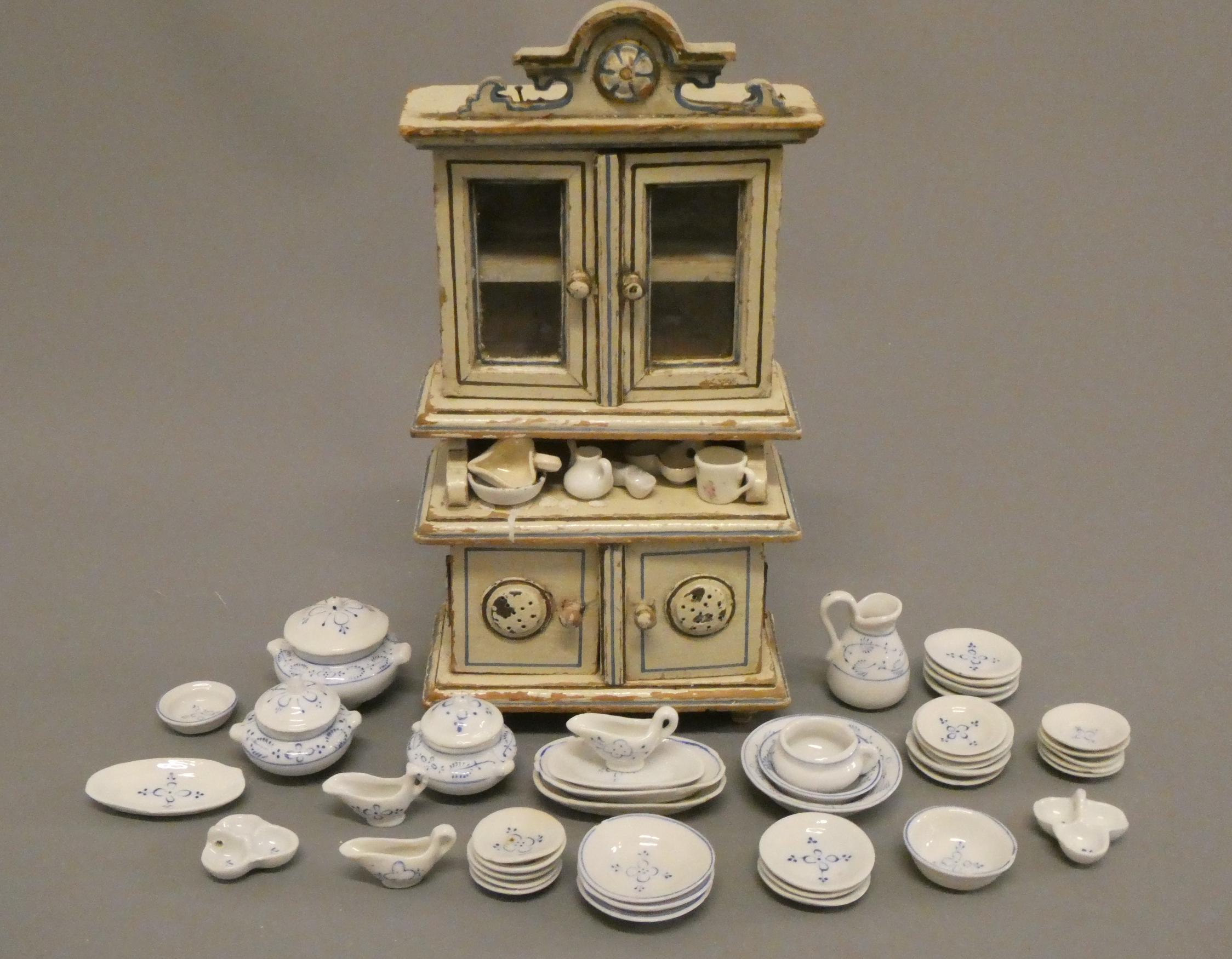 A Victorian doll's house dresser, of painted wood construction, 10 1/4" high, together with a Image