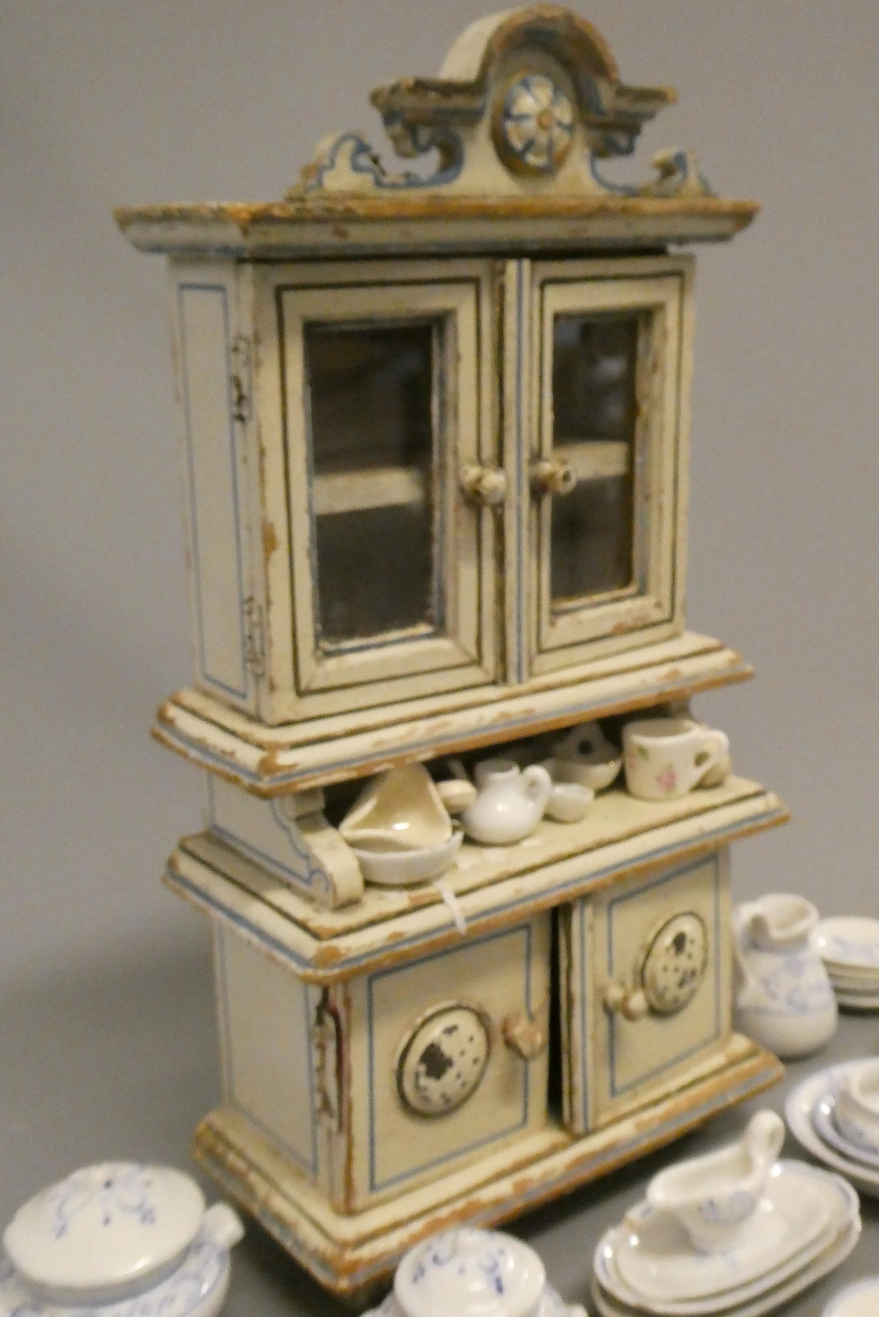 A Victorian doll's house dresser, of painted wood construction, 10 1/4" high, together with a Image