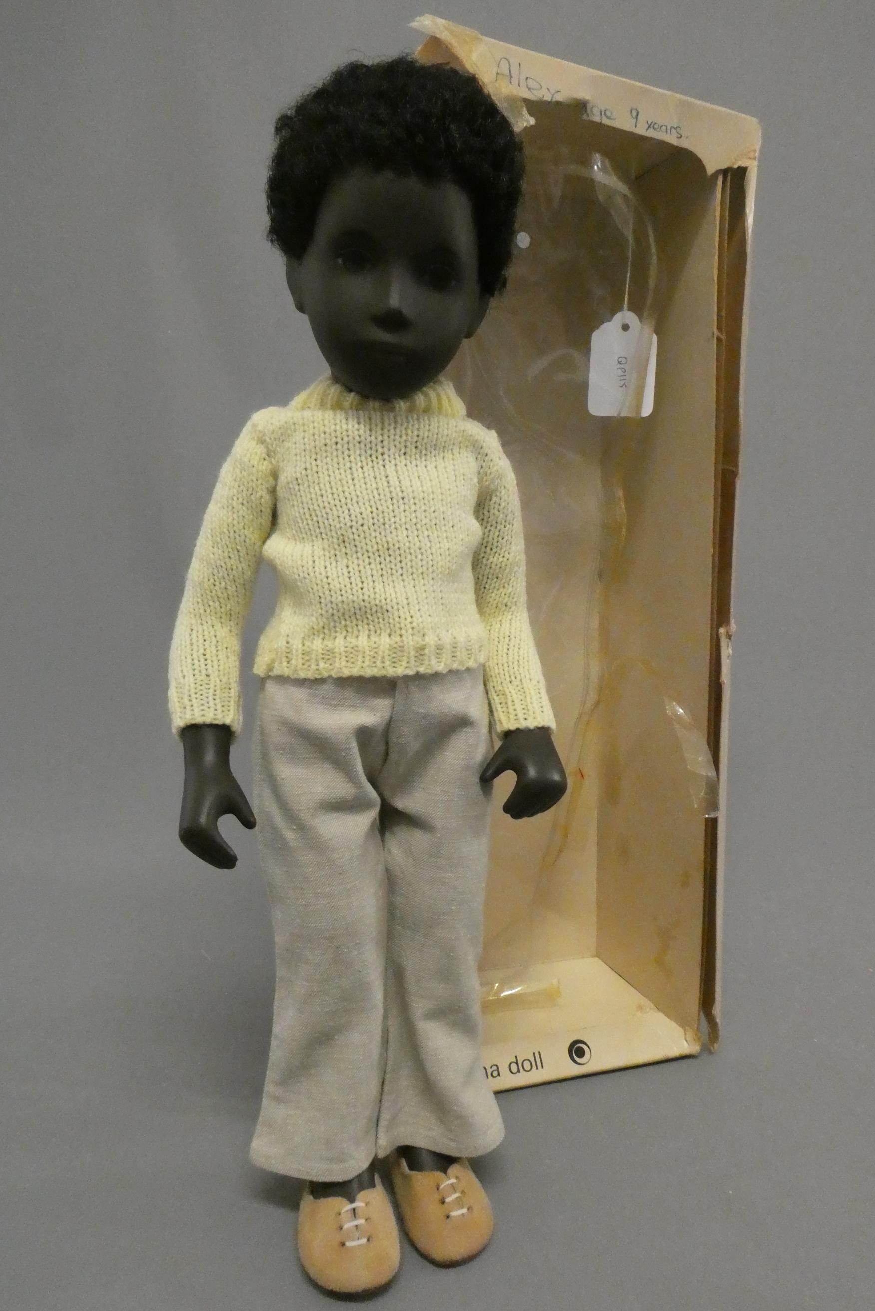 A Sasha doll, 309 "Black Boy Caleb", in original outfit and box, doll 16 1/4" (Est. plus 24% buyer's Image