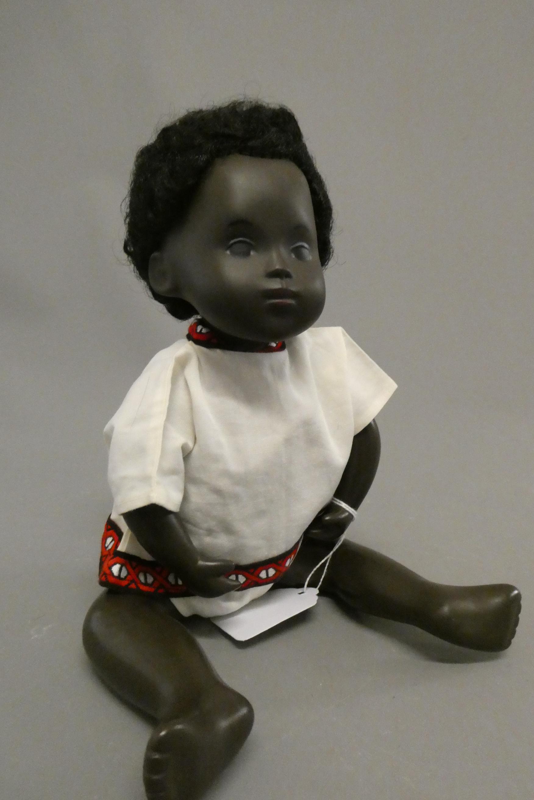 A Sasha baby, with black hair and two piece outfit, 11" long (Est. plus 24% buyer's premium inc. Image