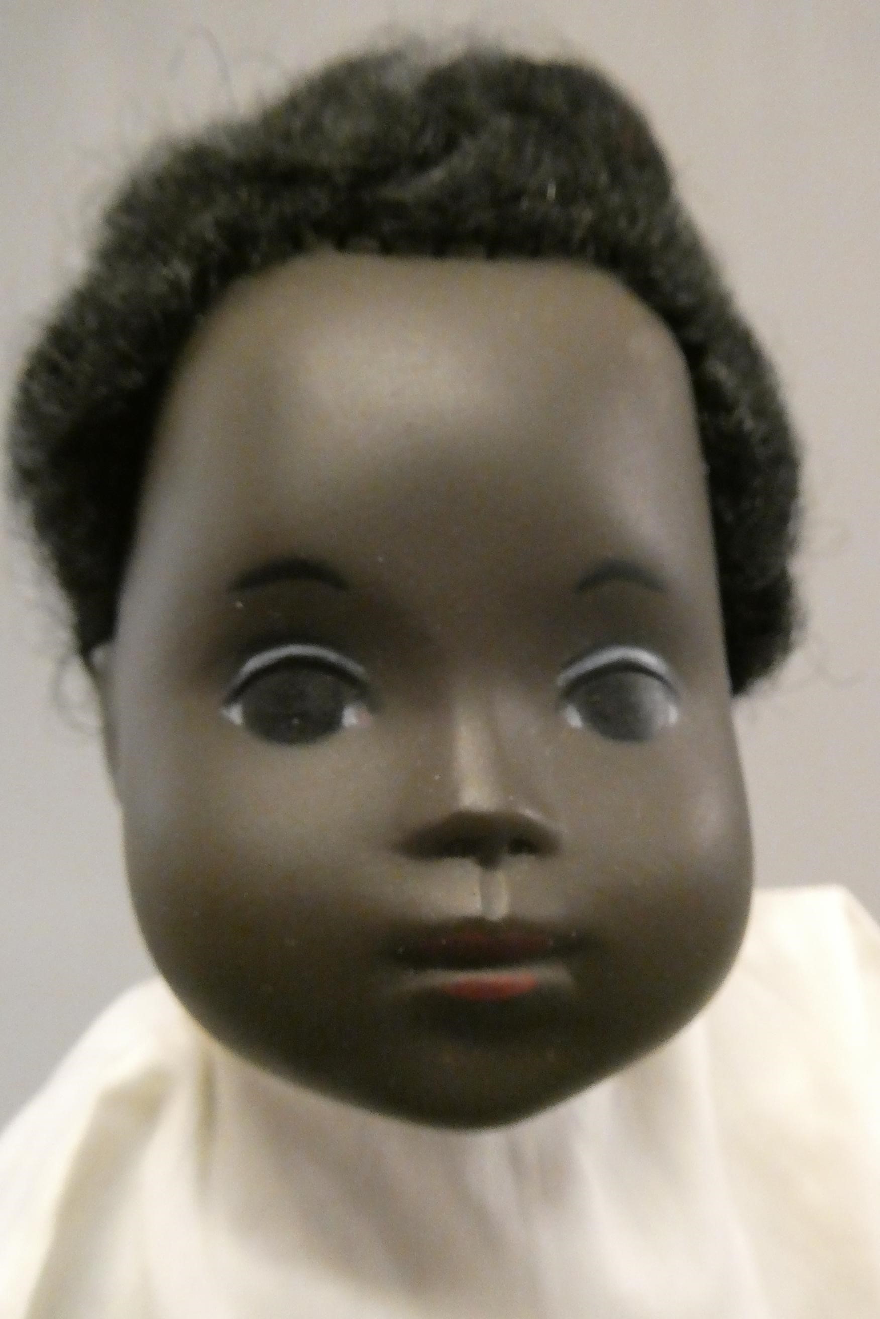 A Sasha baby, with black hair and two piece outfit, 11" long (Est. plus 24% buyer's premium inc. Image