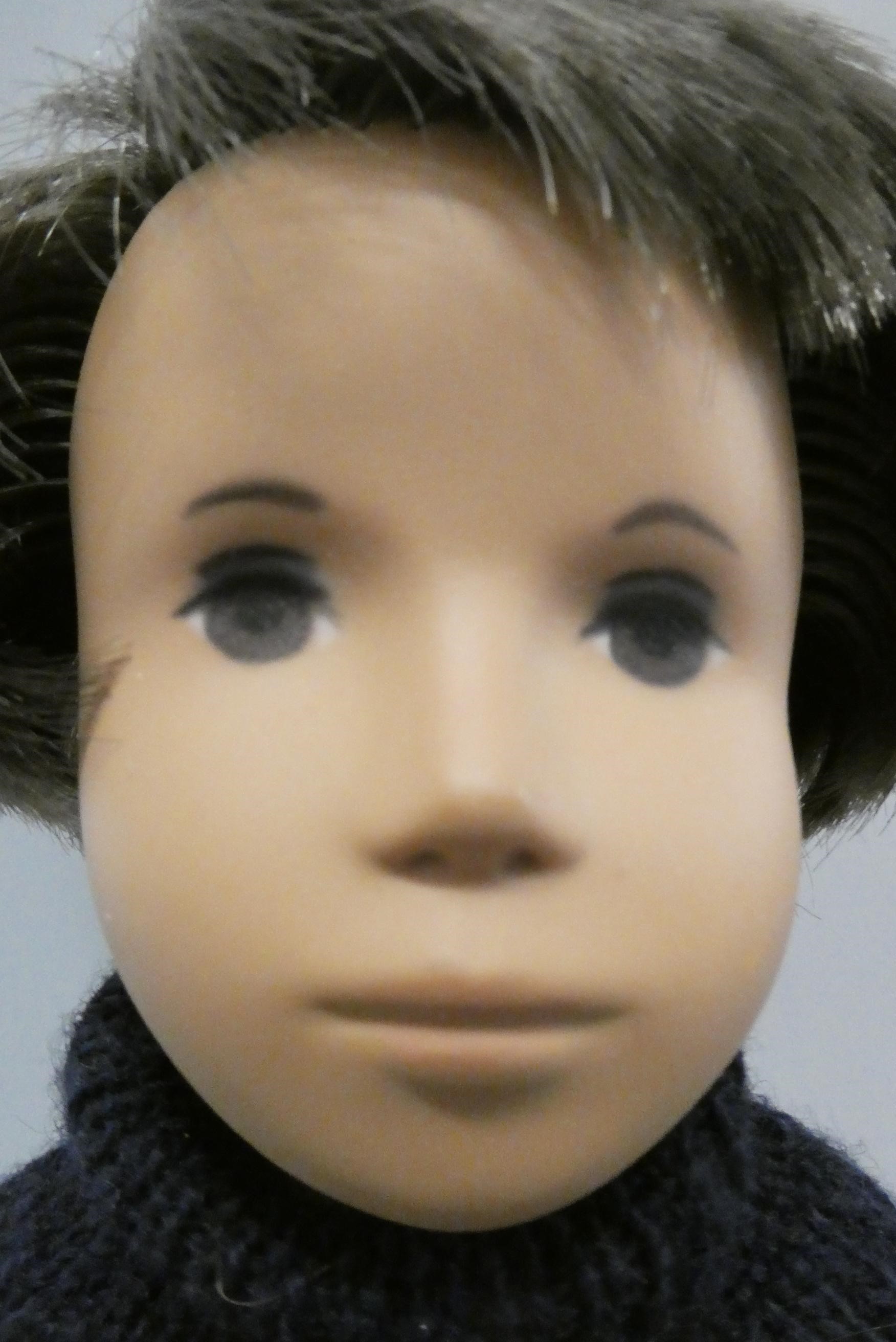 A Sasha boy doll, with brown hair and original outfit including leather sandals, 16" long (Est. plus Image