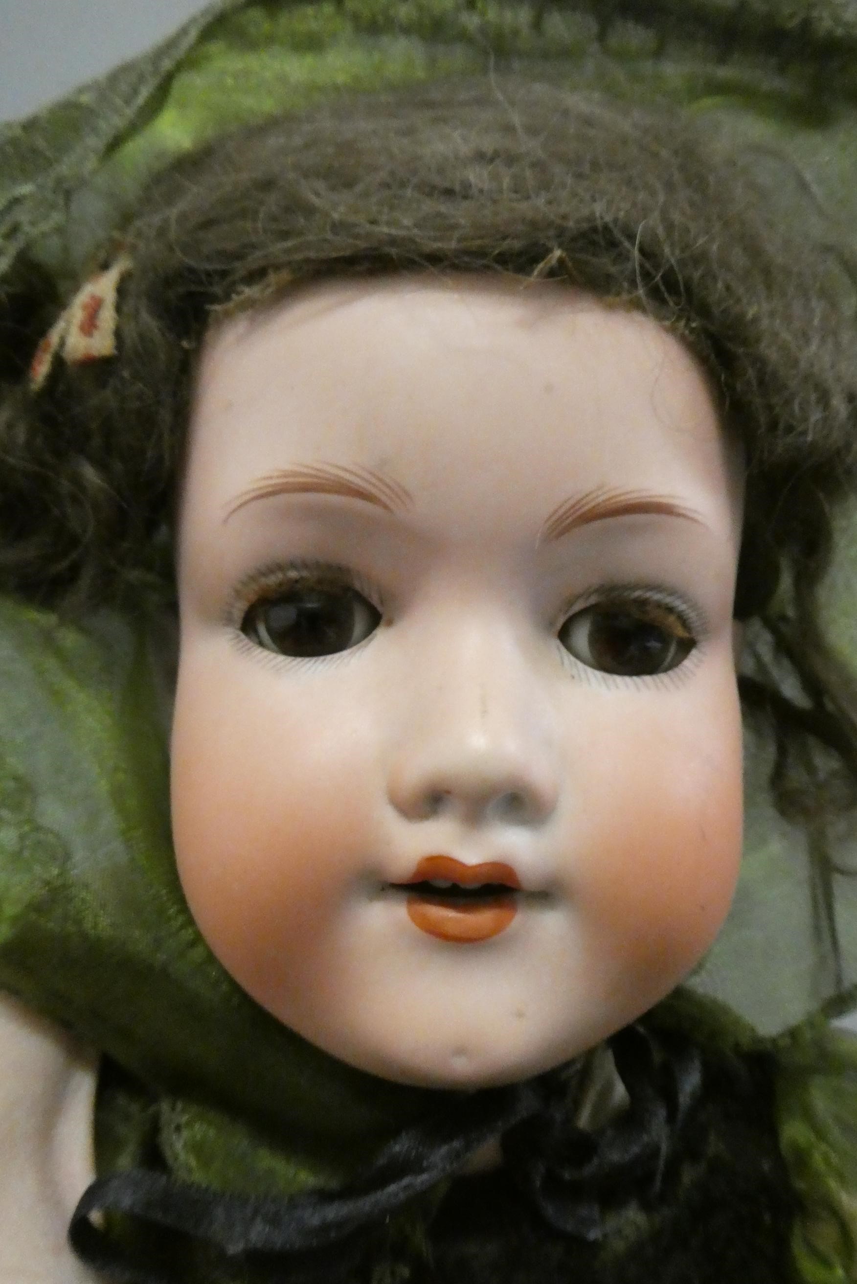 An Armand Marseille bisque socket head doll Image