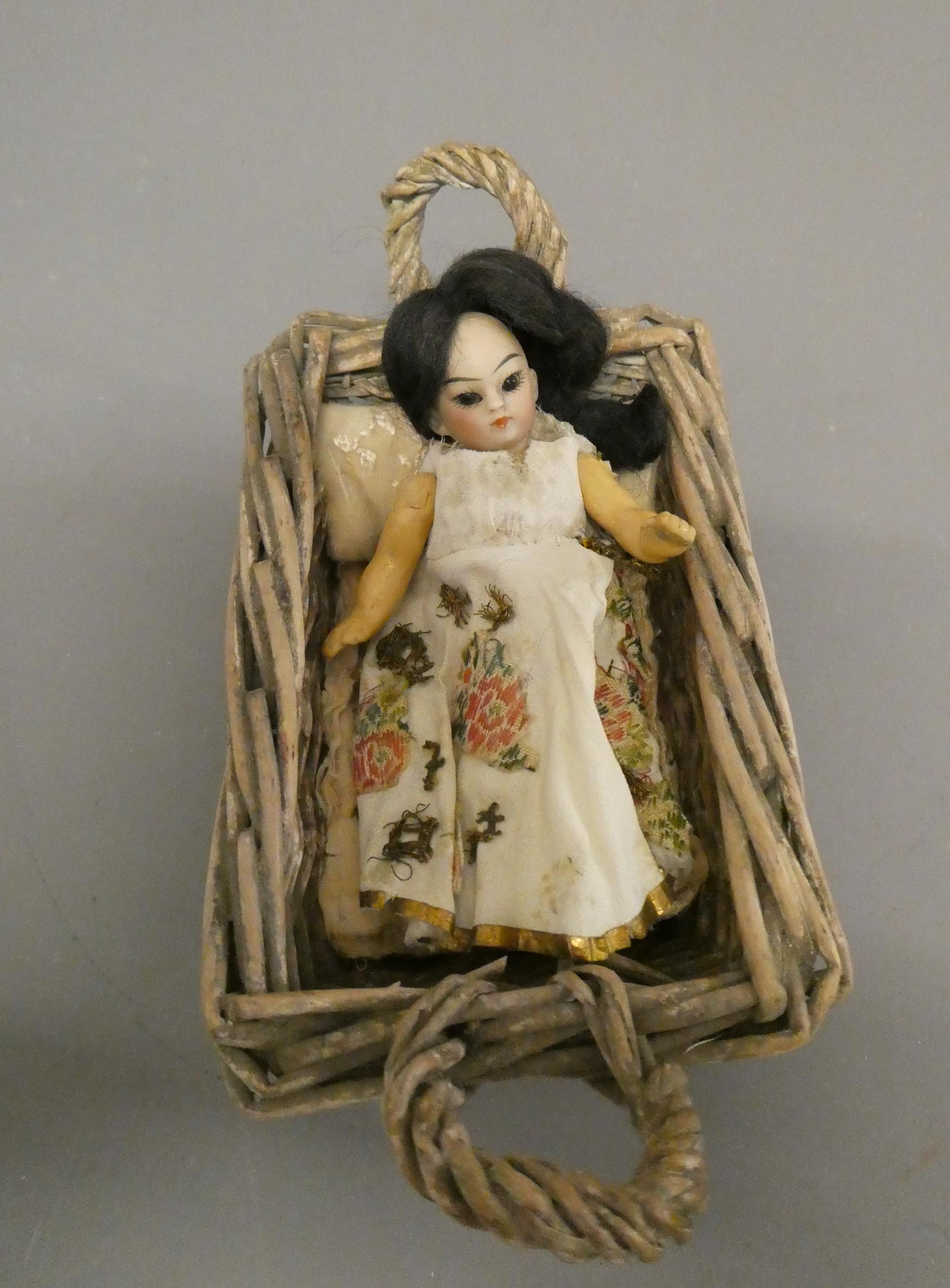 An oriental bisque socket head doll's house doll Image