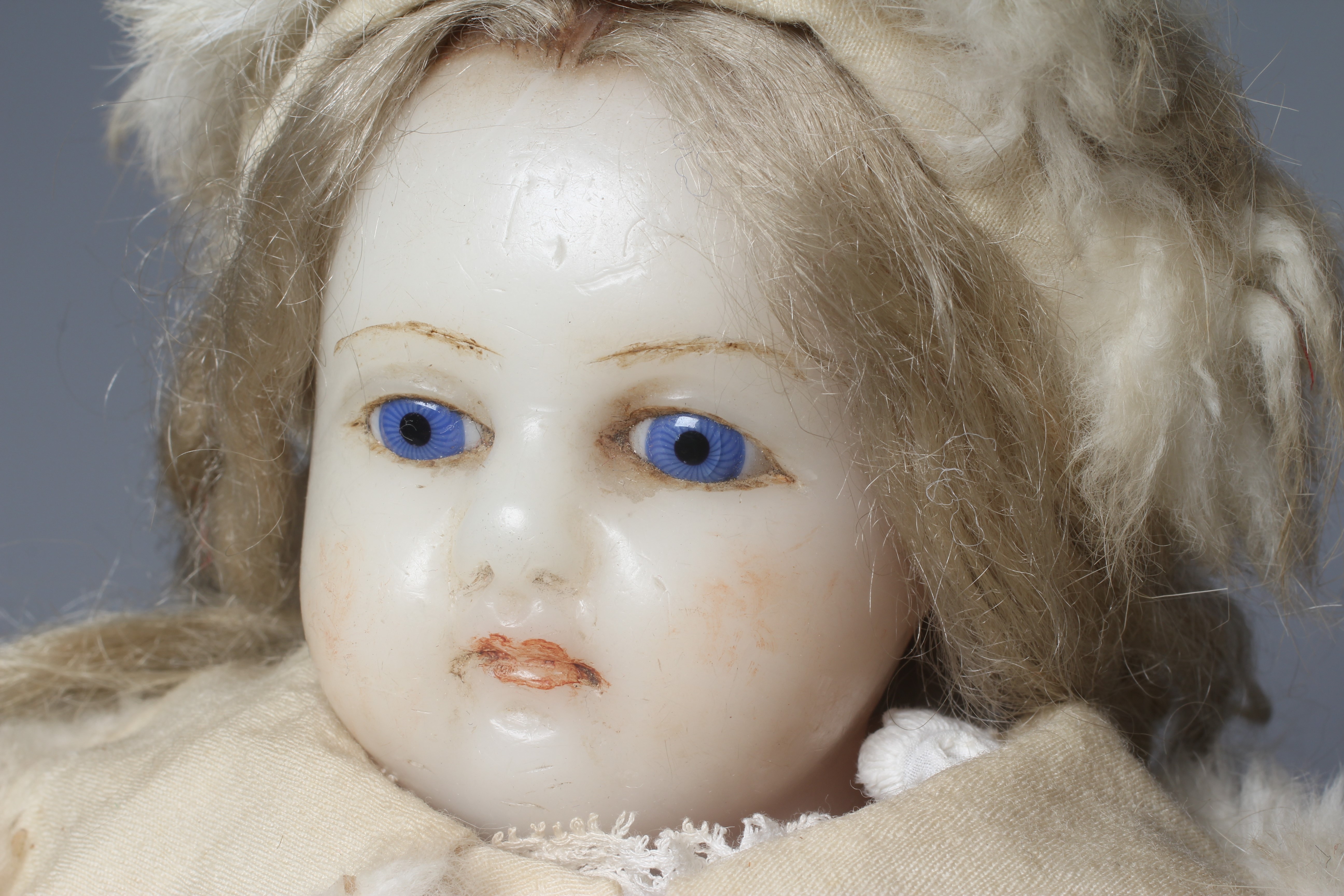 A Victorian poured wax shoulder head doll Image