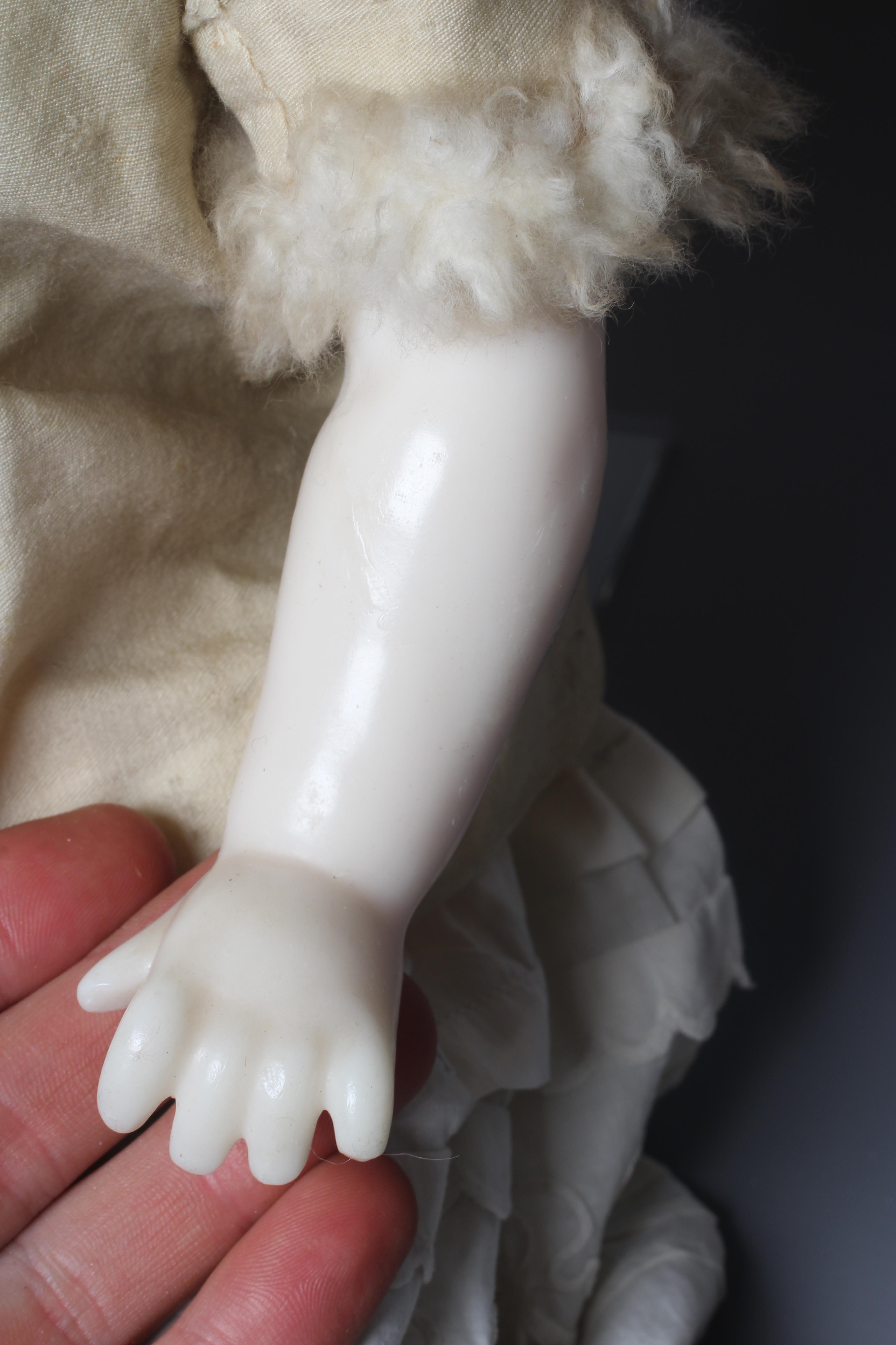 A Victorian poured wax shoulder head doll Image