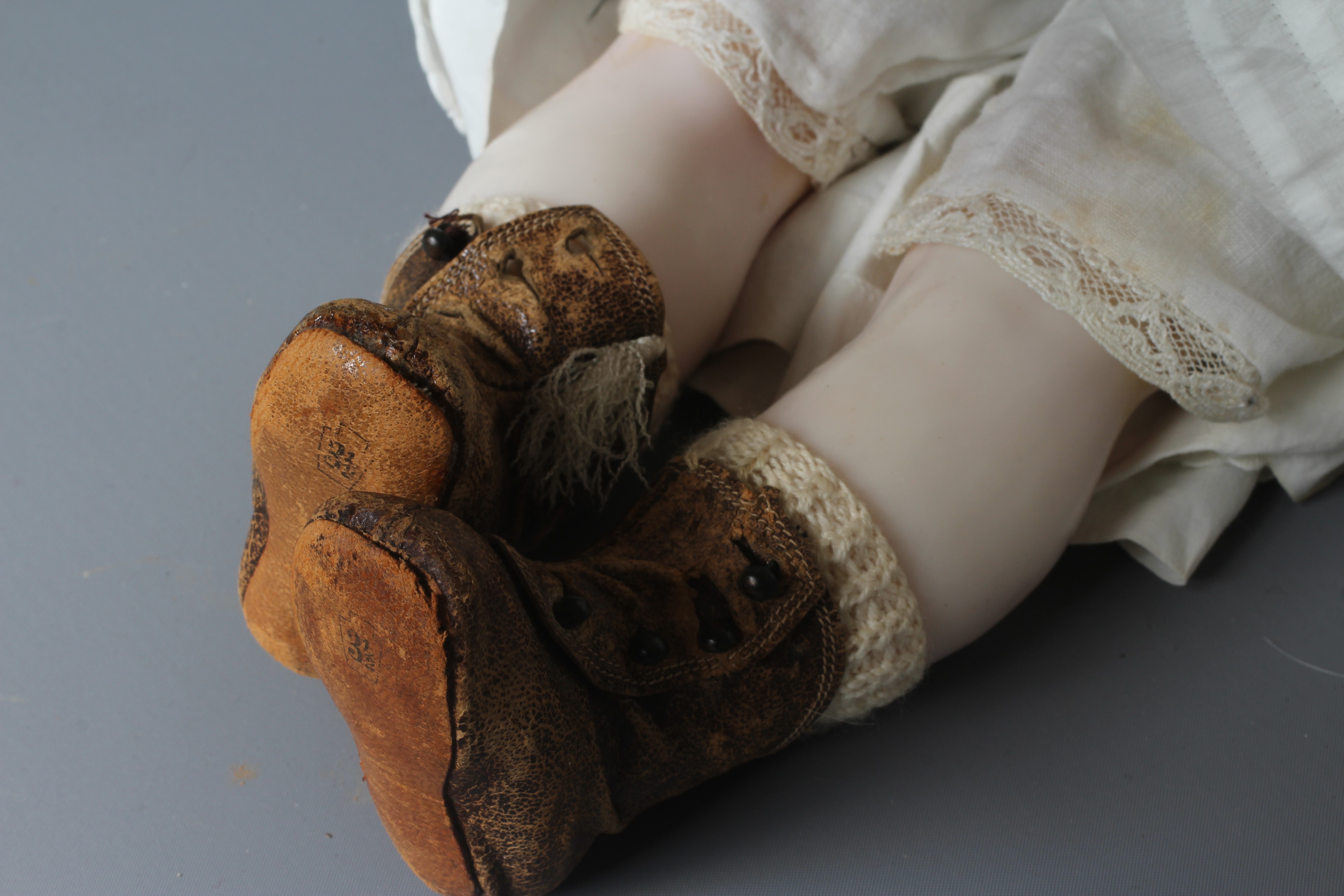 A Victorian poured wax shoulder head doll Image