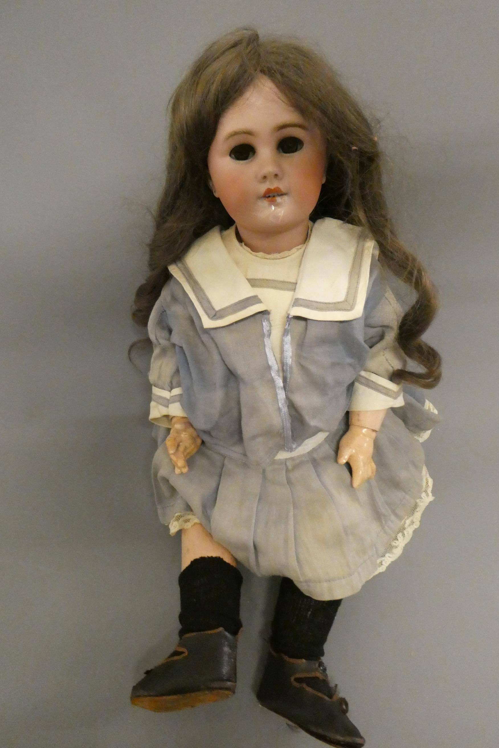 A Bebe Jumeau bisque socket head doll Image