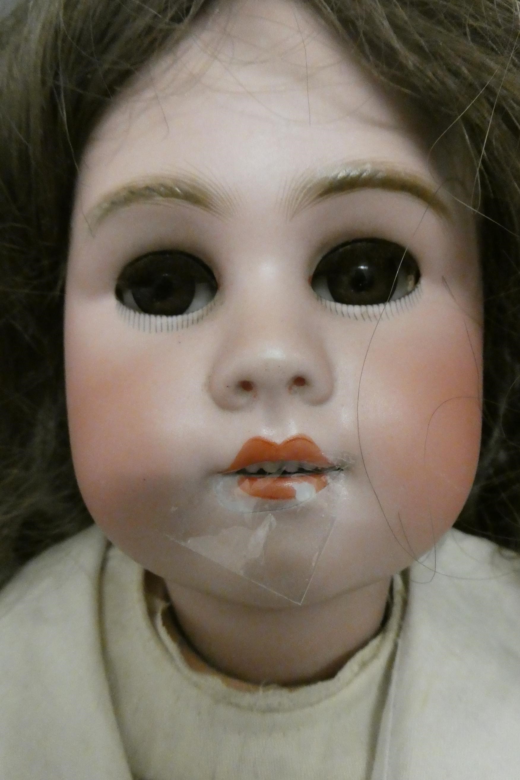 A Bebe Jumeau bisque socket head doll Image