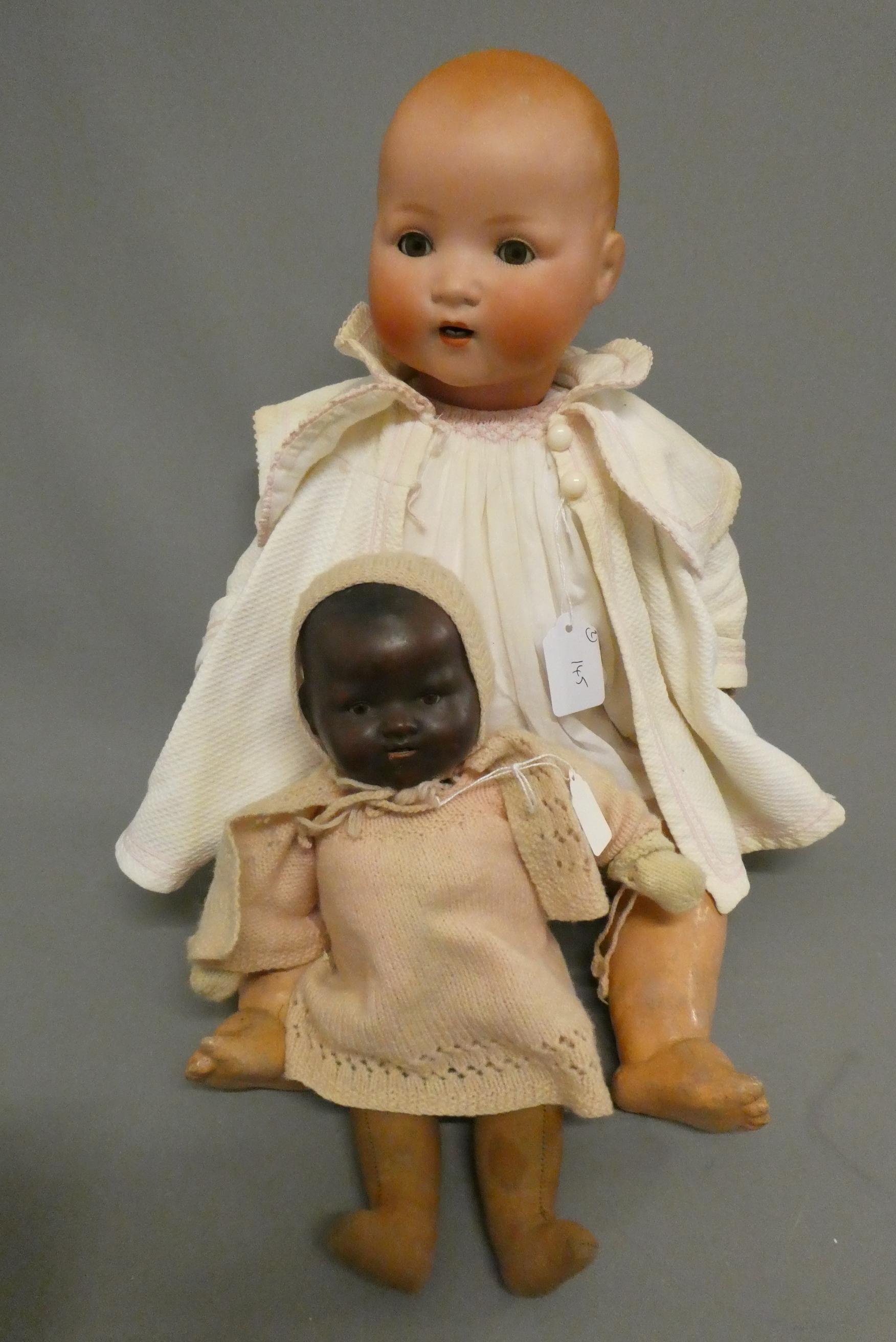 Two Armand Marseille bisque baby dolls, comprising a 23 1/2" 241-7 with sleeping eyes and open Image