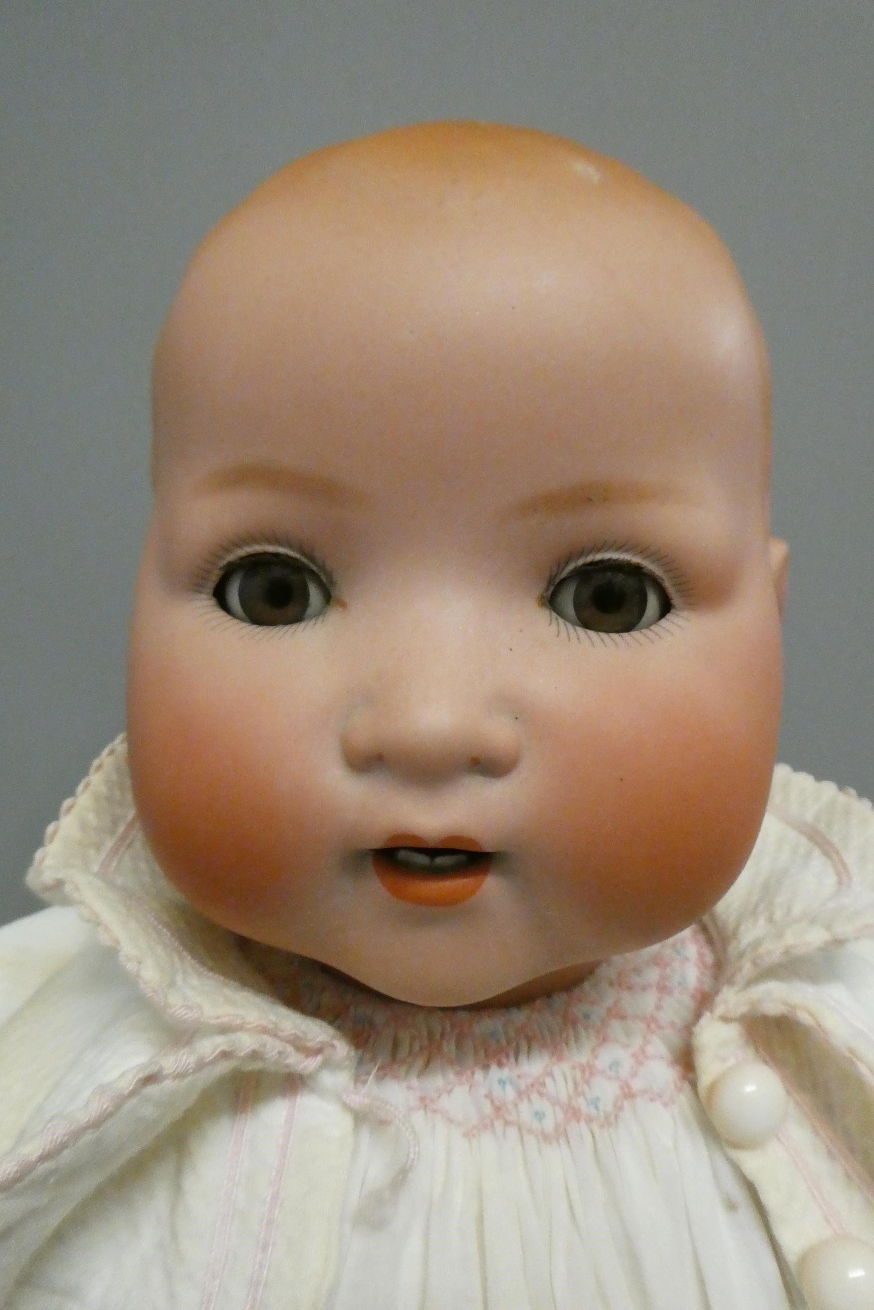 Two Armand Marseille bisque baby dolls, comprising a 23 1/2" 241-7 with sleeping eyes and open Image