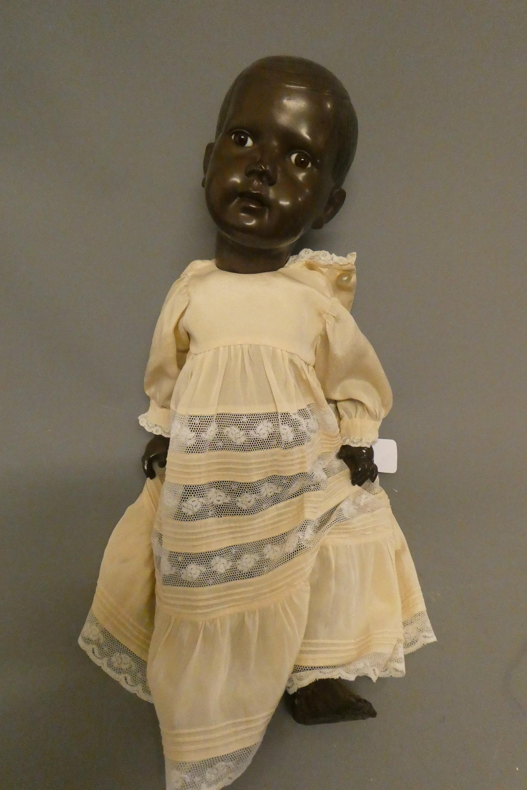 A Rheinische Gummi celluloid baby boy doll, with brown glass fixed eyes, moulded hair, closed mouth Image
