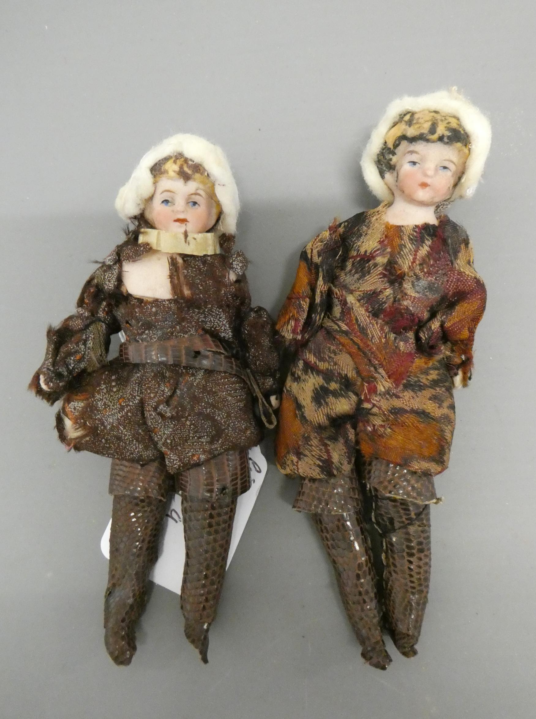 A pair of bisque shoulder head doll's house dolls, with moulded blond hair, painted features, bisque Image