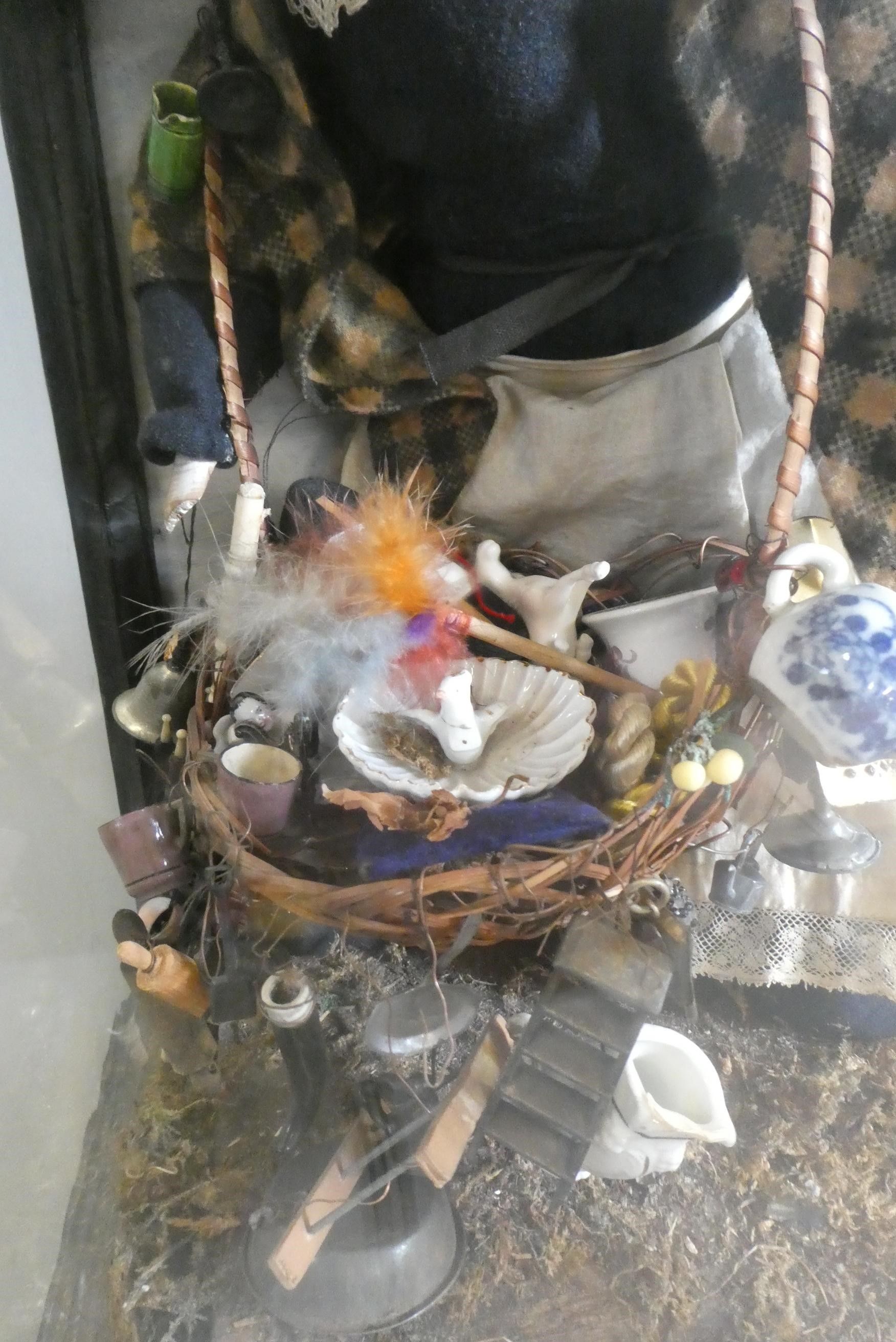 A cased haberdashery saleswoman peg doll Image