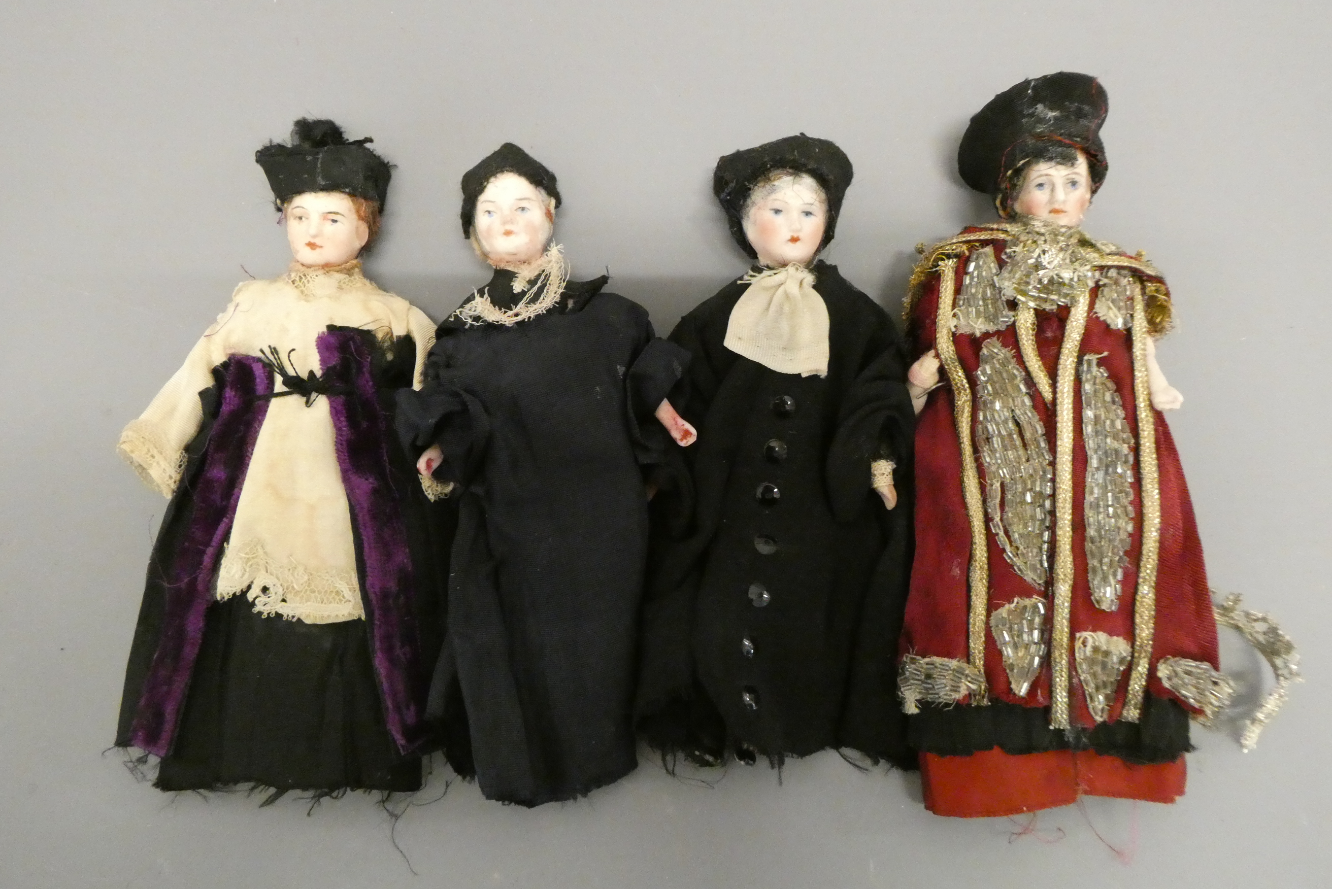 Four bisque shoulder head doll's house dolls, comprising four male priests, all with bisque lower Image