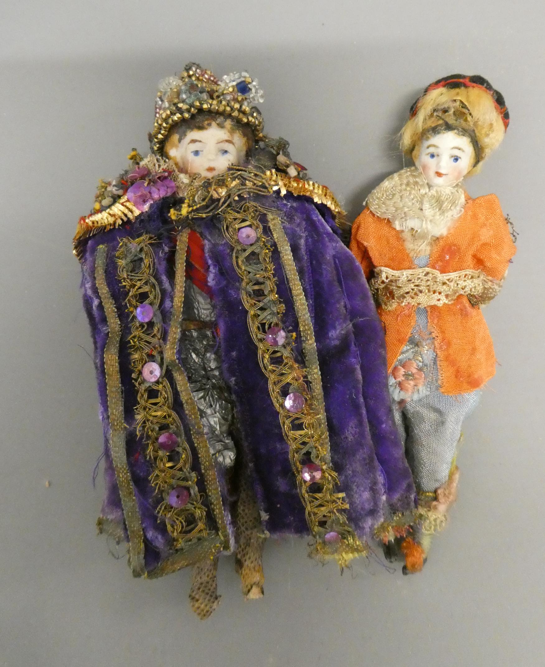 Two bisque shoulder head doll's house dolls, both with moulded hair, painted features and bisque Image