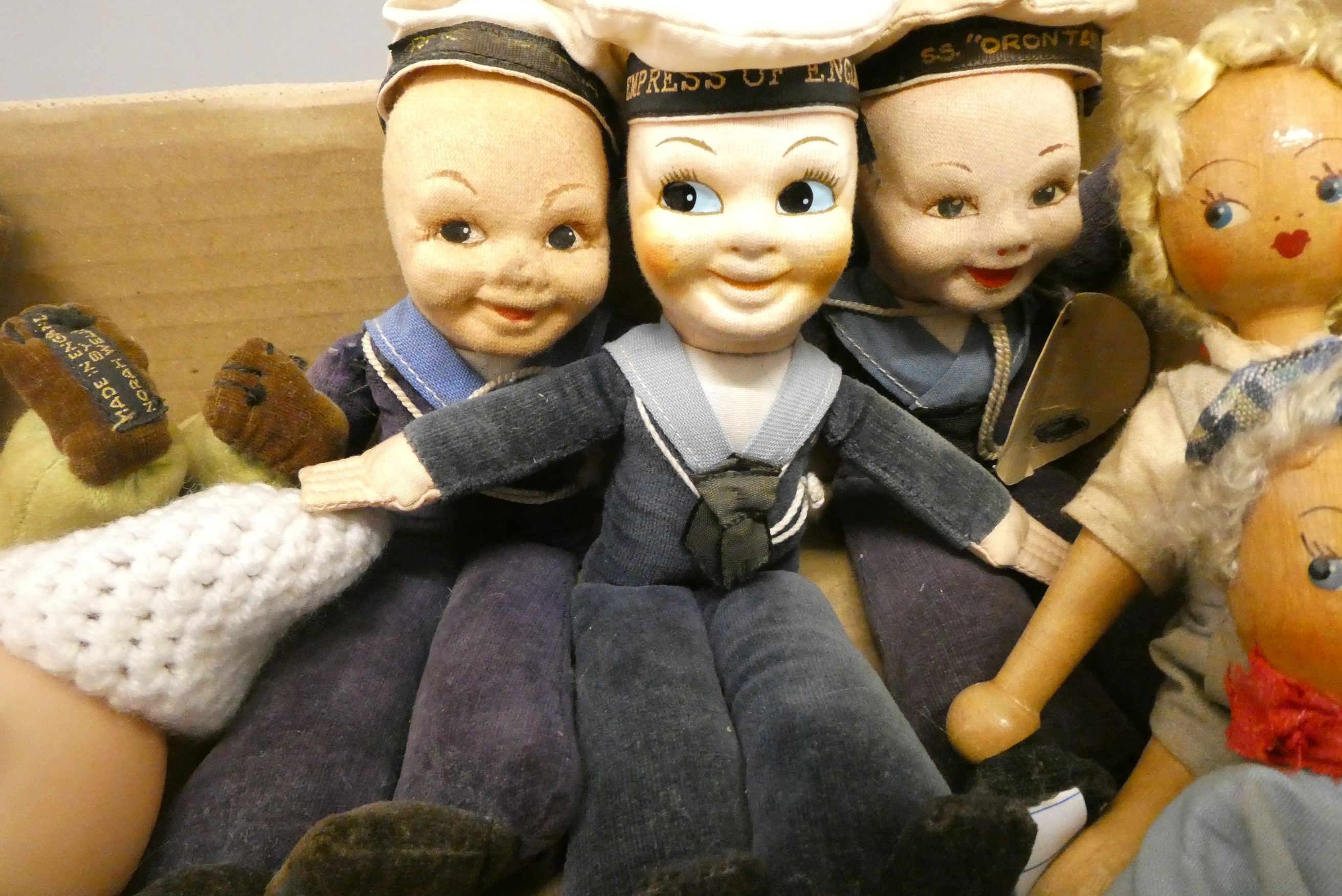 A box of mainly vintage dolls, including four Norah Wellings dolls and a reversible fabric doll Image