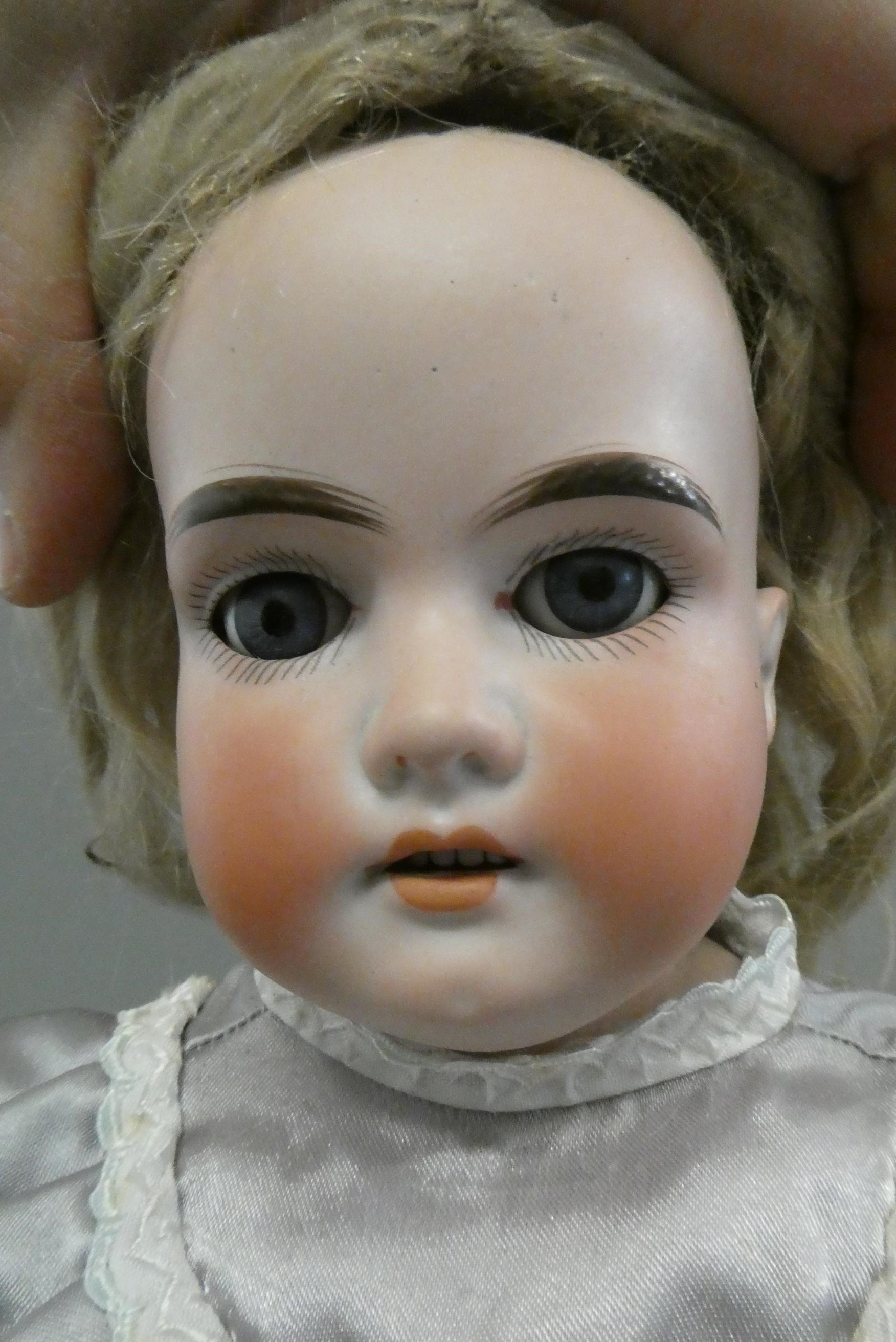 Two Armand Marseille bisque shoulder head dolls Image