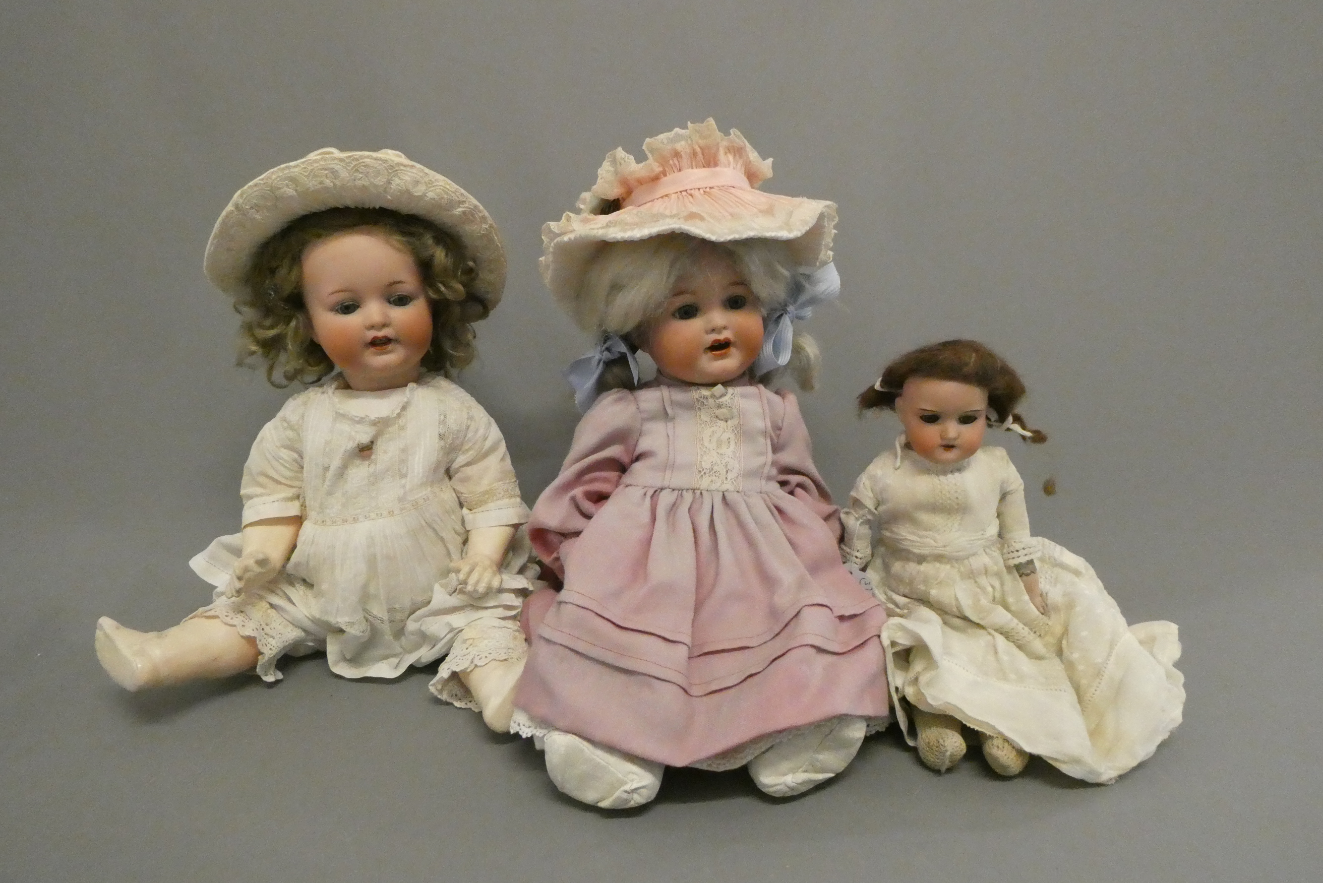 Three Armand Marseille bisque head dolls Image