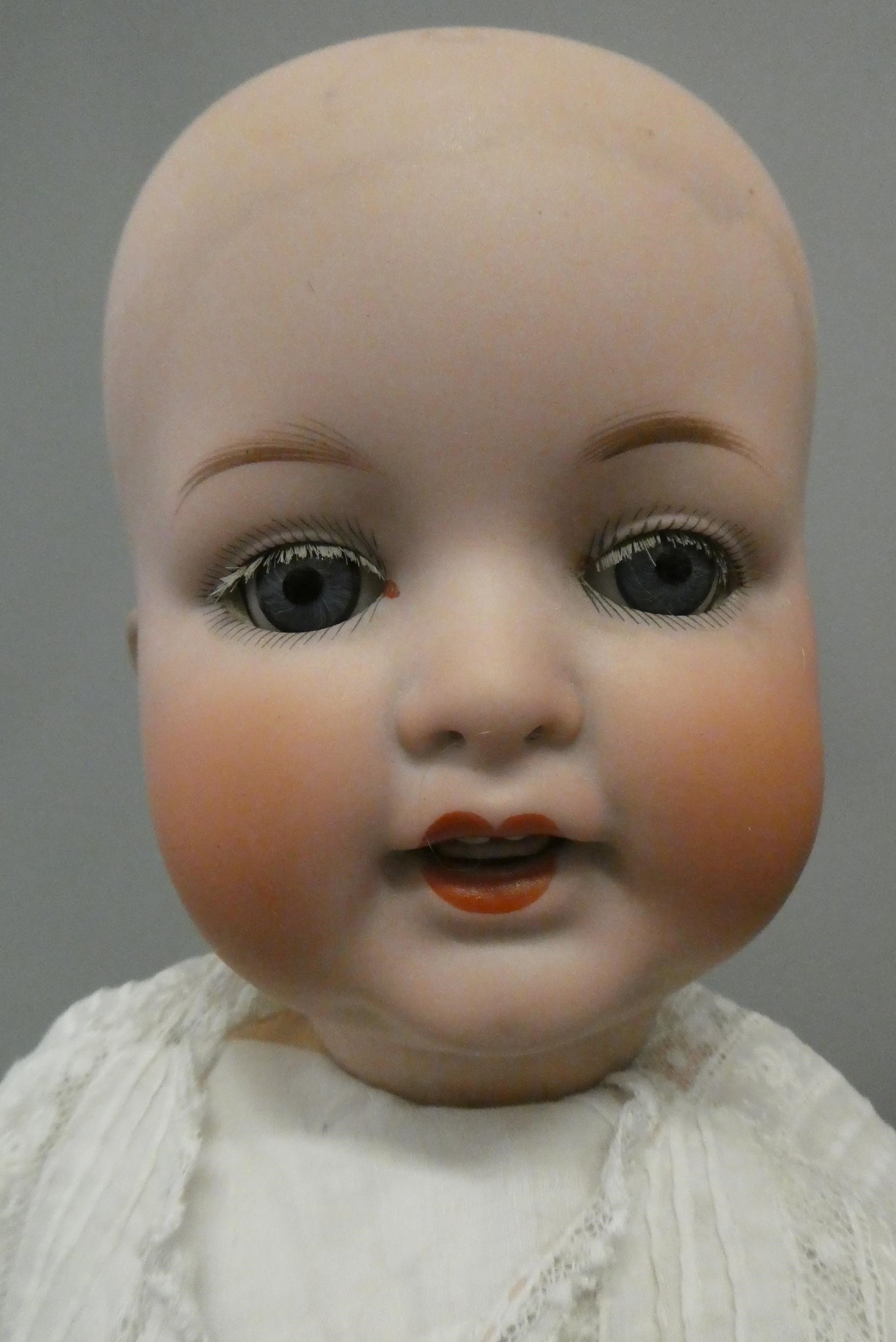 Three Armand Marseille bisque head dolls Image