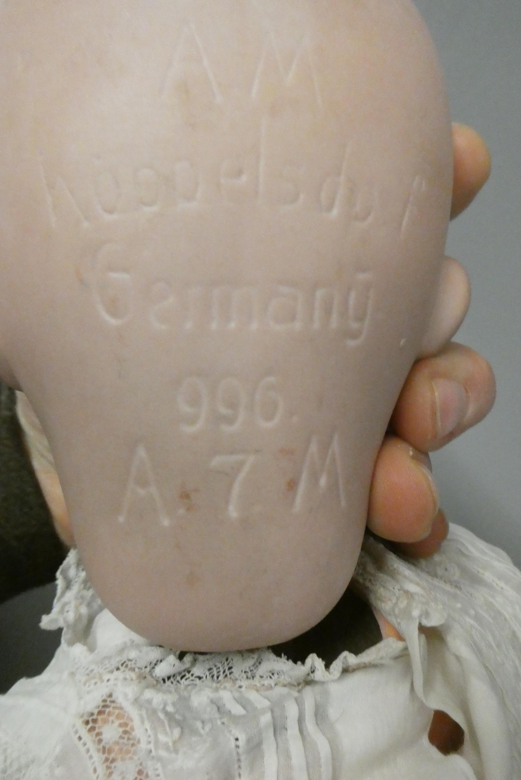Three Armand Marseille bisque head dolls Image