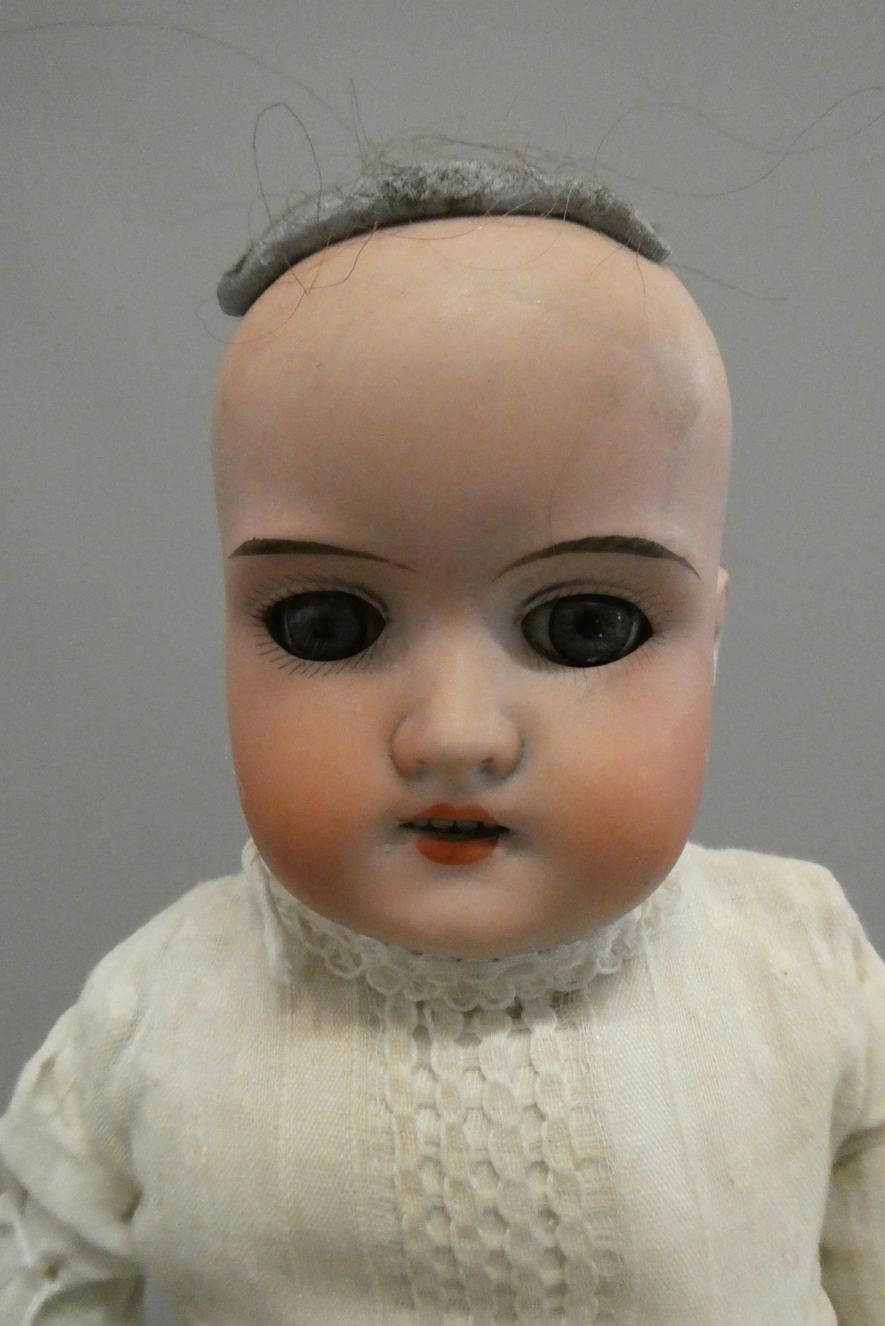 Three Armand Marseille bisque head dolls Image