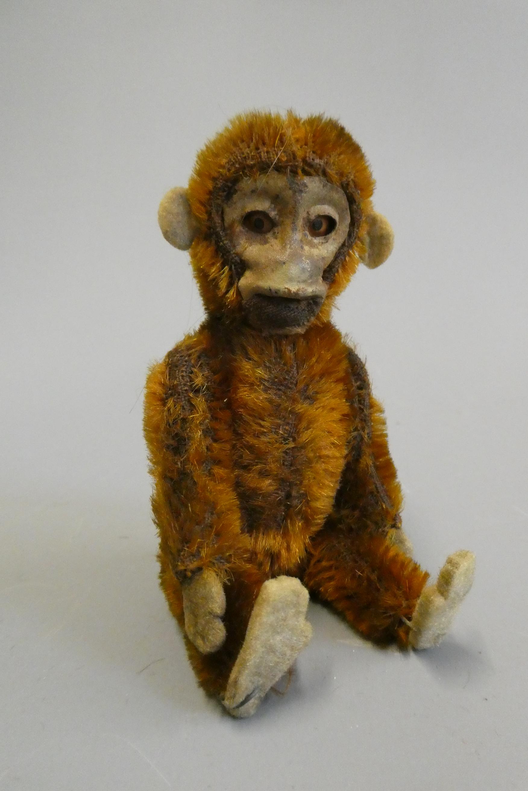 Schuco monkey perfume bottle, with brown plush, felt ears, feet and hands, jointed body and internal Image