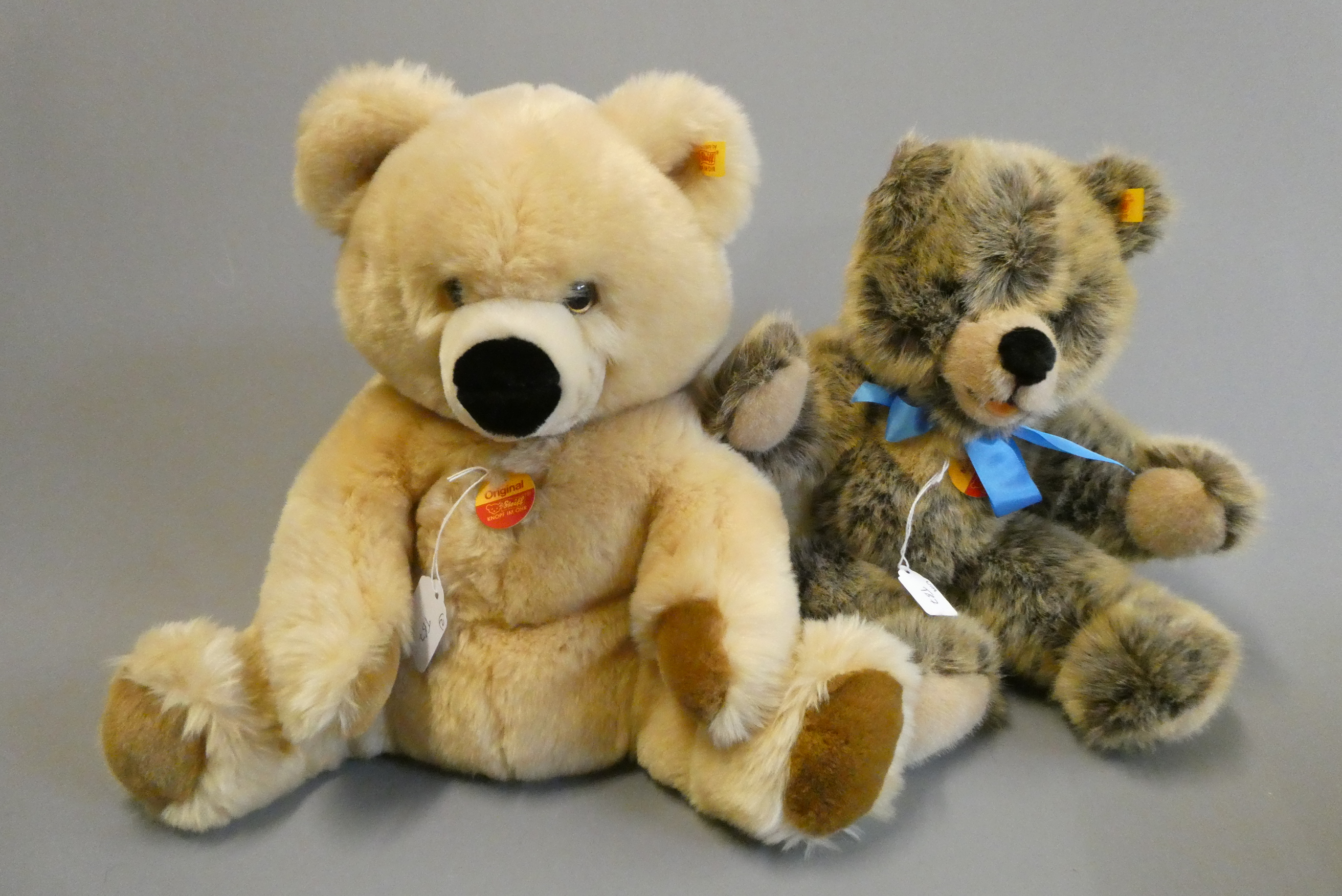 Two Steiff bears, comprising a 14 1/4" "Original" seated bear with light orange plush and a 15" Image