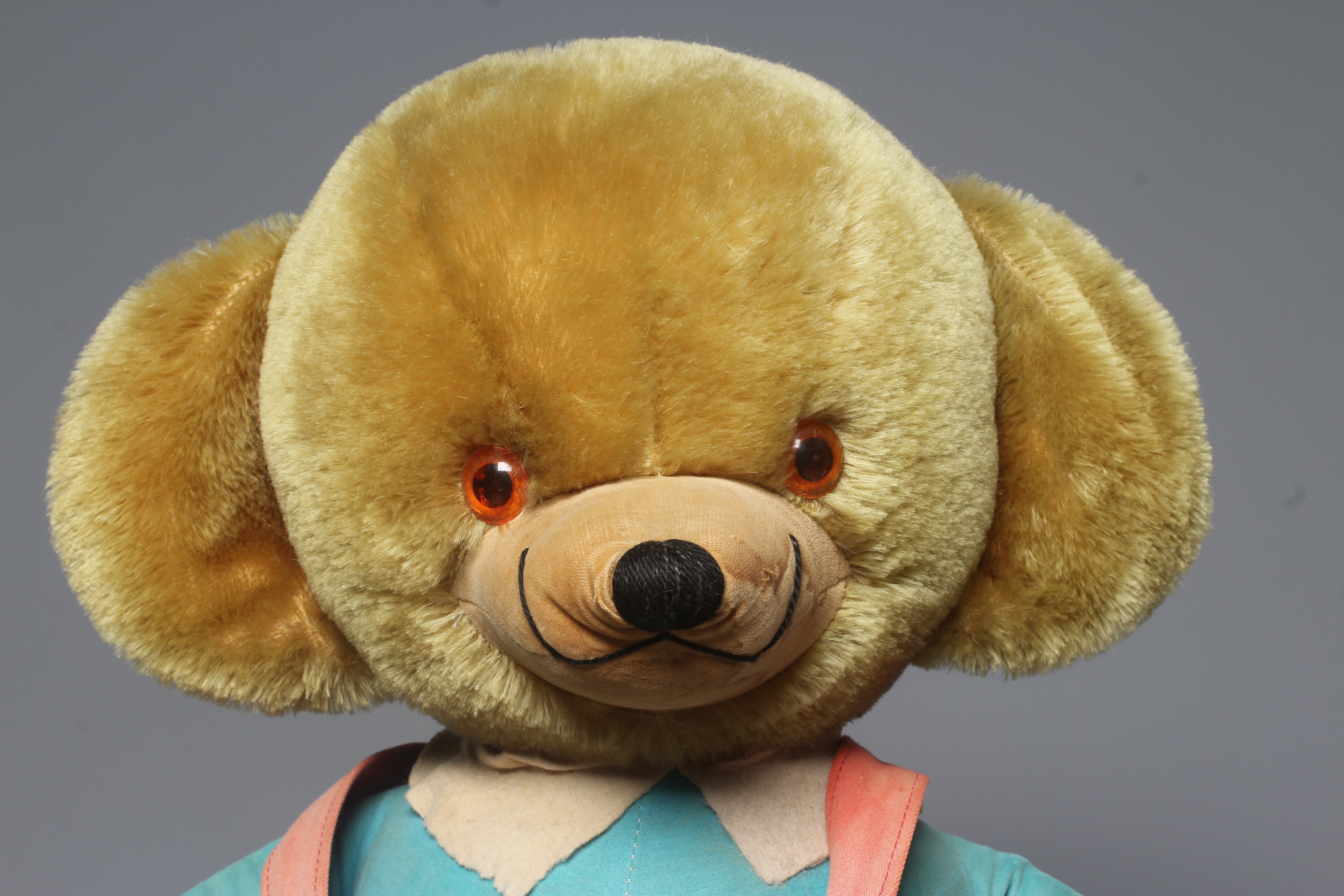 A large Merrythought Mr Twisty cheeky bear, with ear bells, original outfit and label to foot, 22 Image