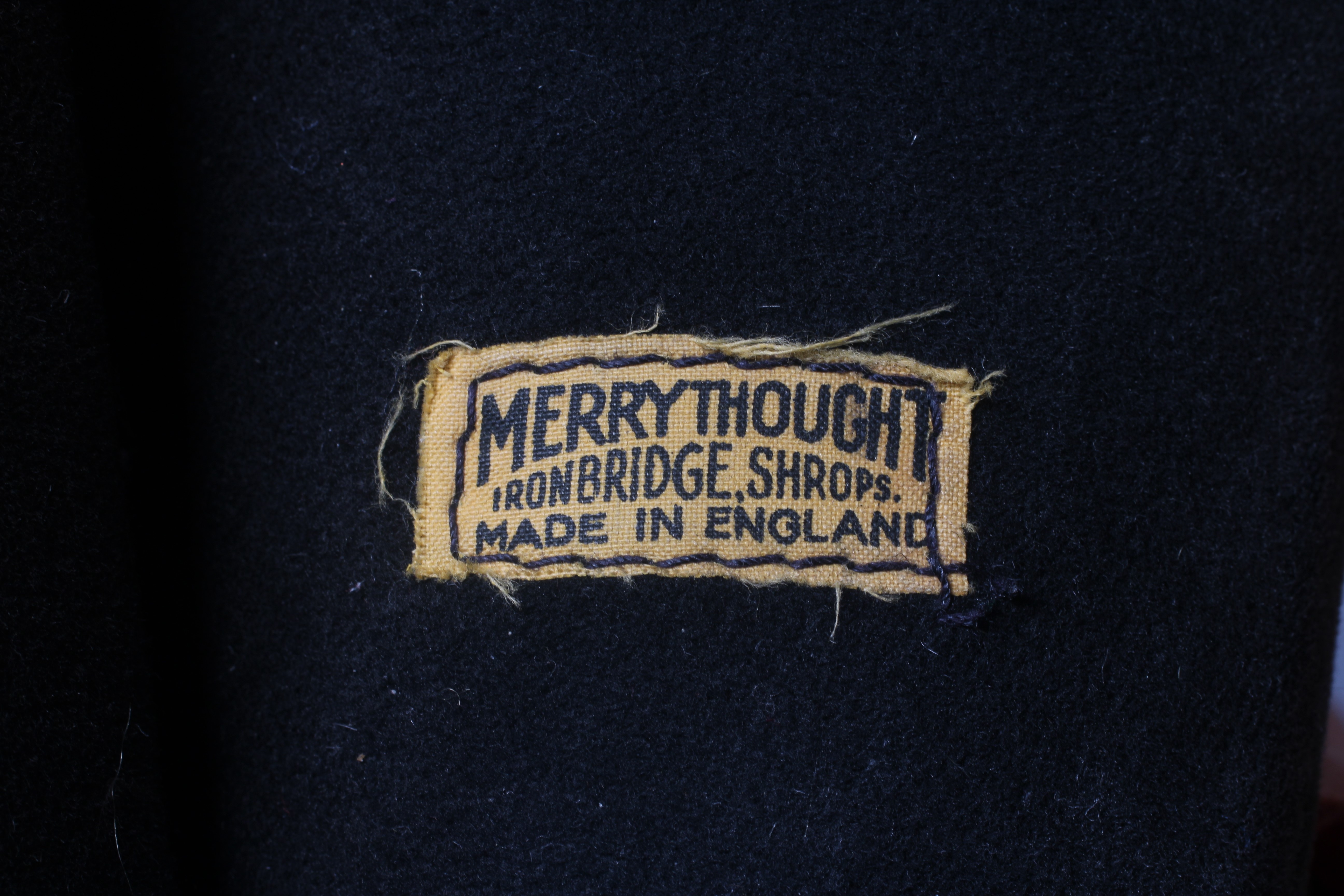 A large Merrythought Mr Twisty cheeky bear, with ear bells, original outfit and label to foot, 22 Image