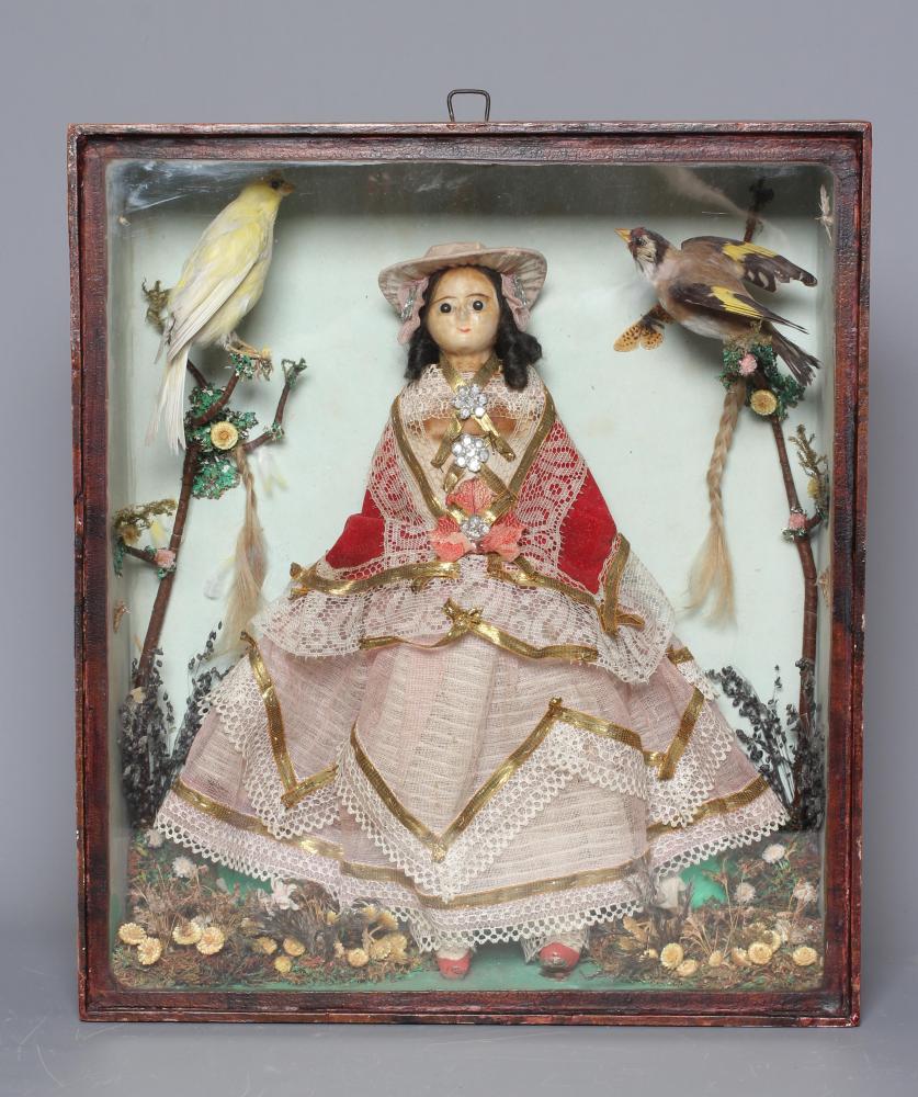 A wax head doll and taxidermy diorama Image