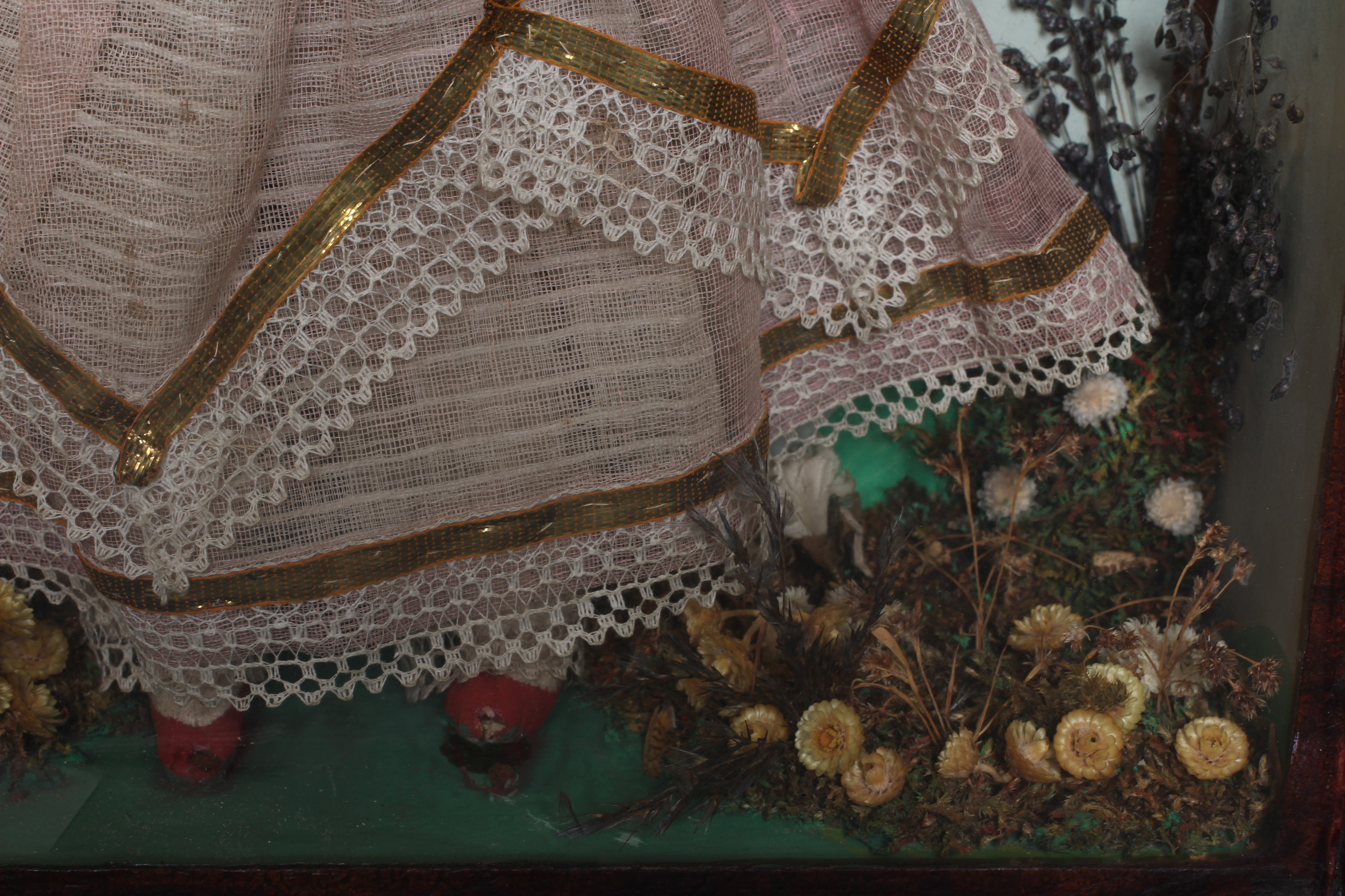 A wax head doll and taxidermy diorama Image