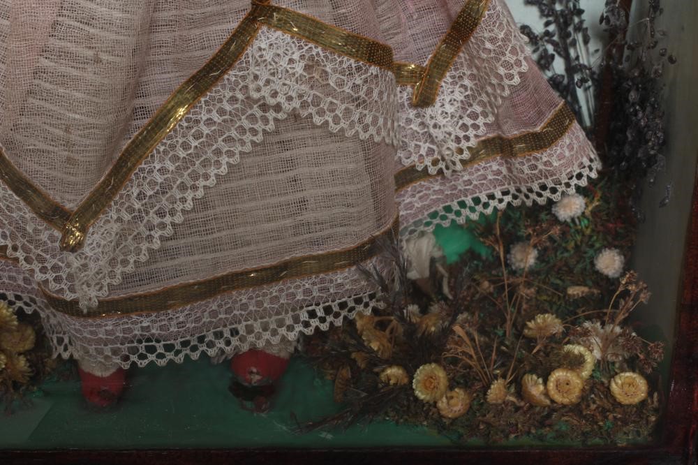 A wax head doll and taxidermy diorama Image