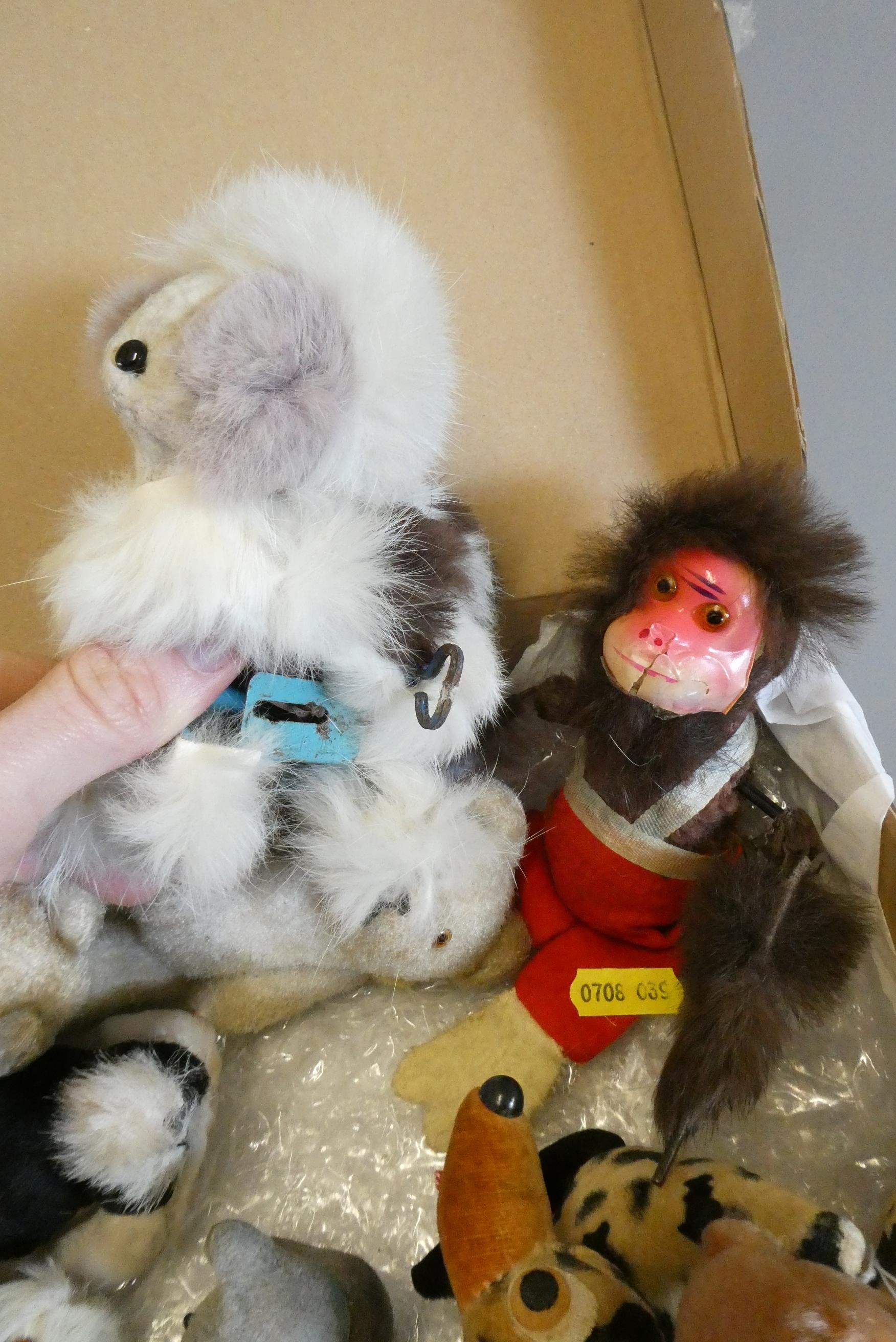 A collection of vintage plush toys including two clockwork toys, a German sheep and three lambs with Image
