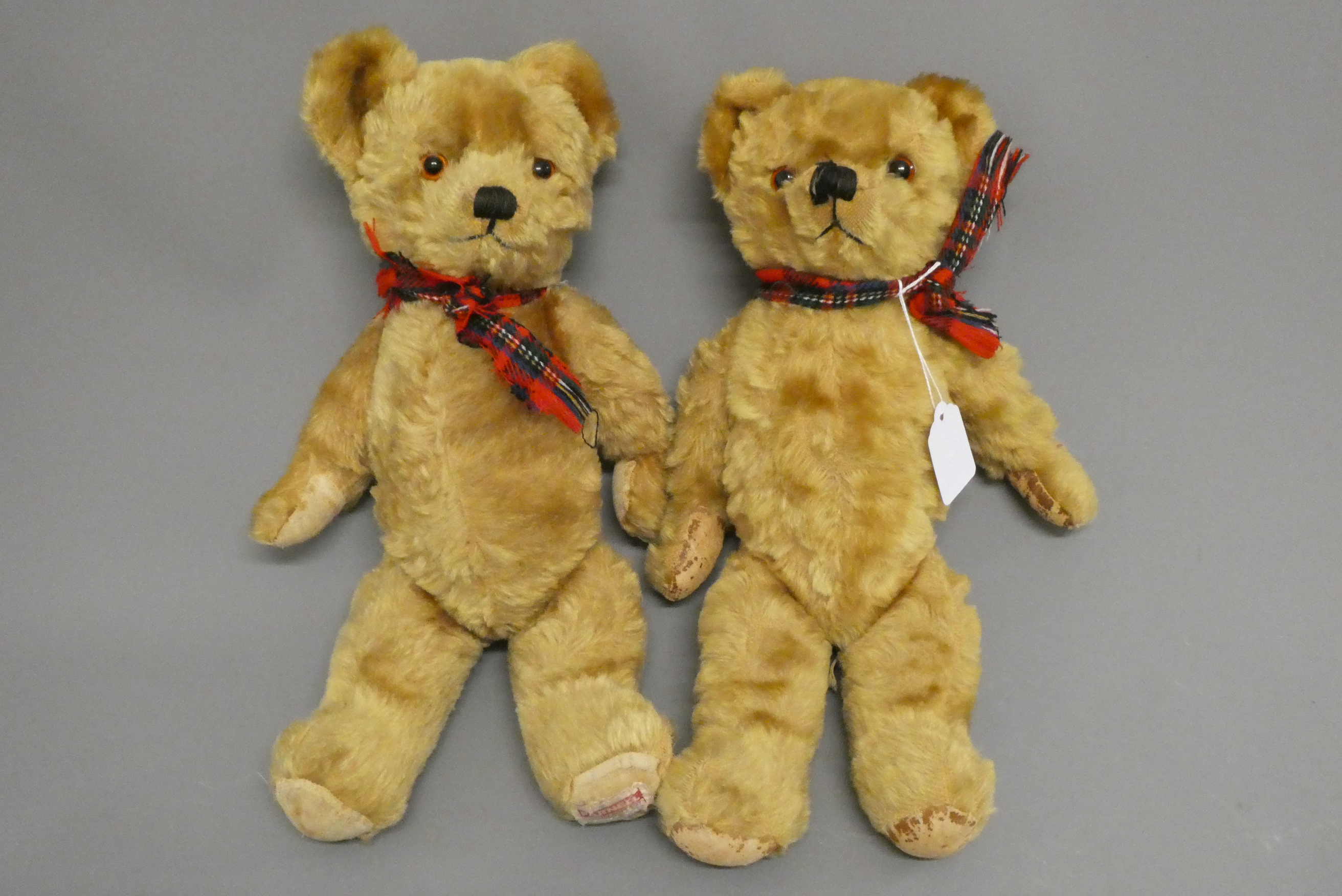 Twin Farnell teddy bears, with sewn noses, amber glass eyes, fabric pads and one with maker's label Image