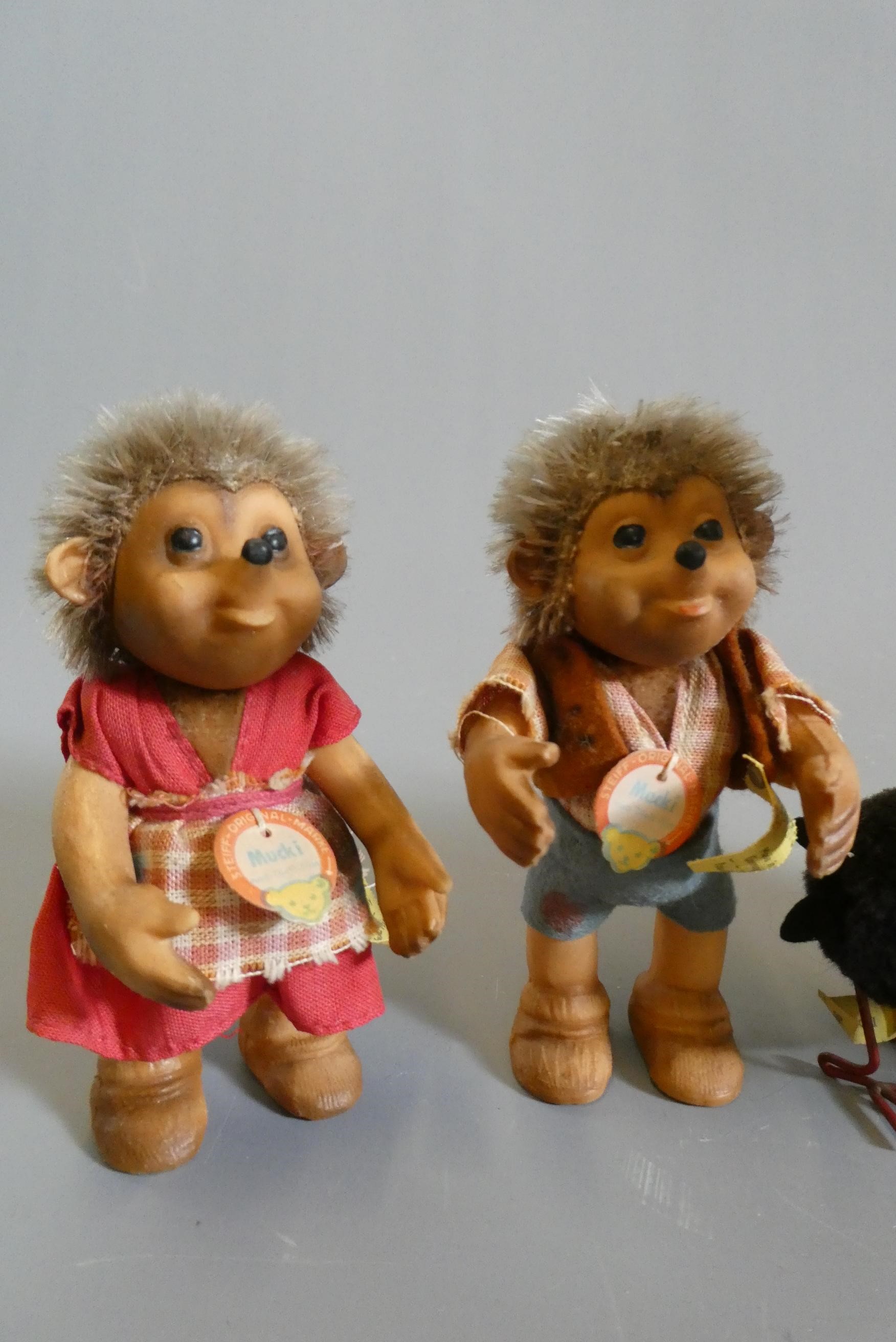 Five Steiff plush animals, comprising three Hucky birds of varied sizes with wire legs and labels, a Image