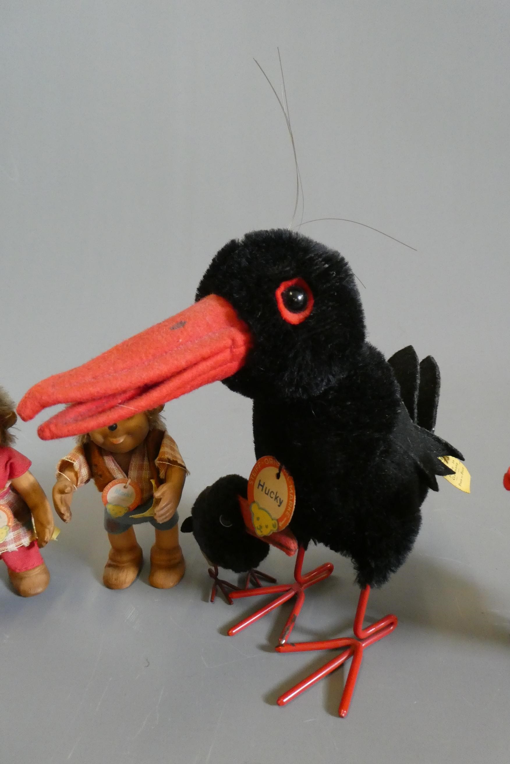 Five Steiff plush animals, comprising three Hucky birds of varied sizes with wire legs and labels, a Image
